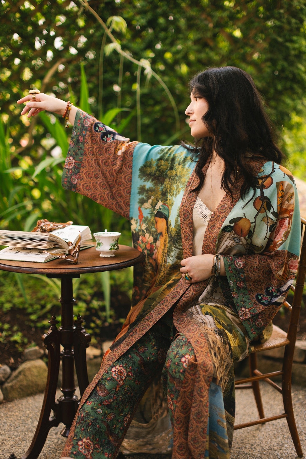 Model wearing Peace, Wine & Sunshine Bohéme Slip Dress featuring botanical collages and playful peace, wine and sunshine lettering on the hem – Market of Stars.