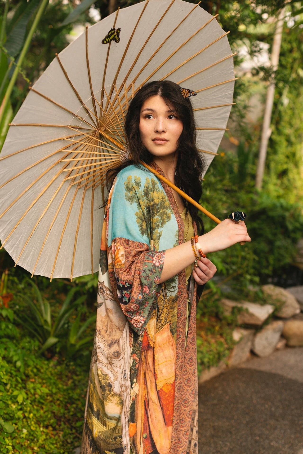 Model wearing Peace, Wine & Sunshine Bohéme Slip Dress featuring botanical collages and playful peace, wine and sunshine lettering on the hem – Market of Stars.