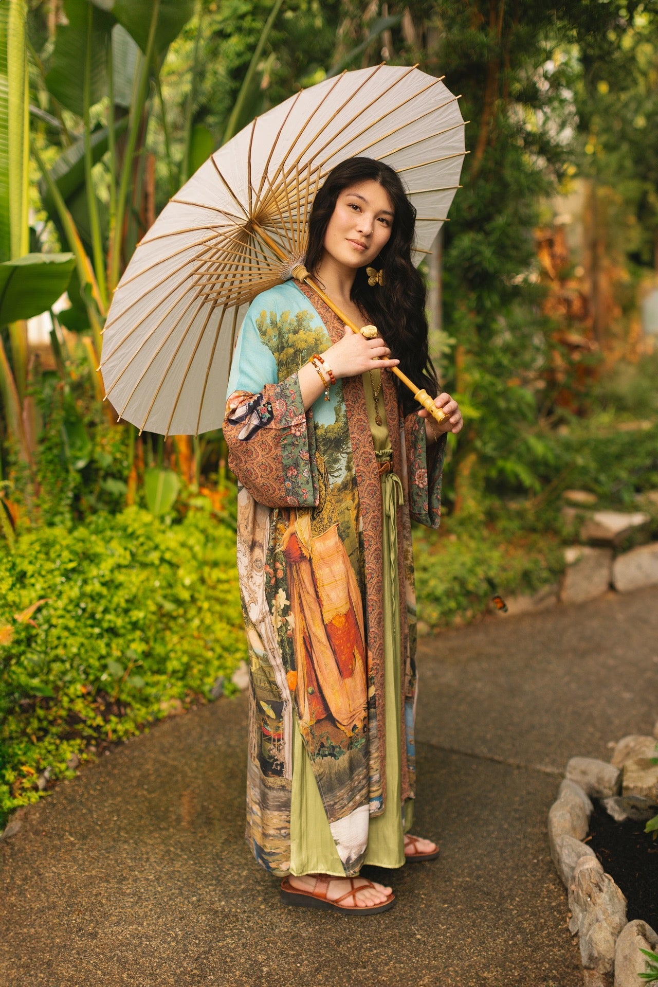Model wearing Peace, Wine & Sunshine Bohéme Slip Dress featuring botanical collages and playful peace, wine and sunshine lettering on the hem – Market of Stars.