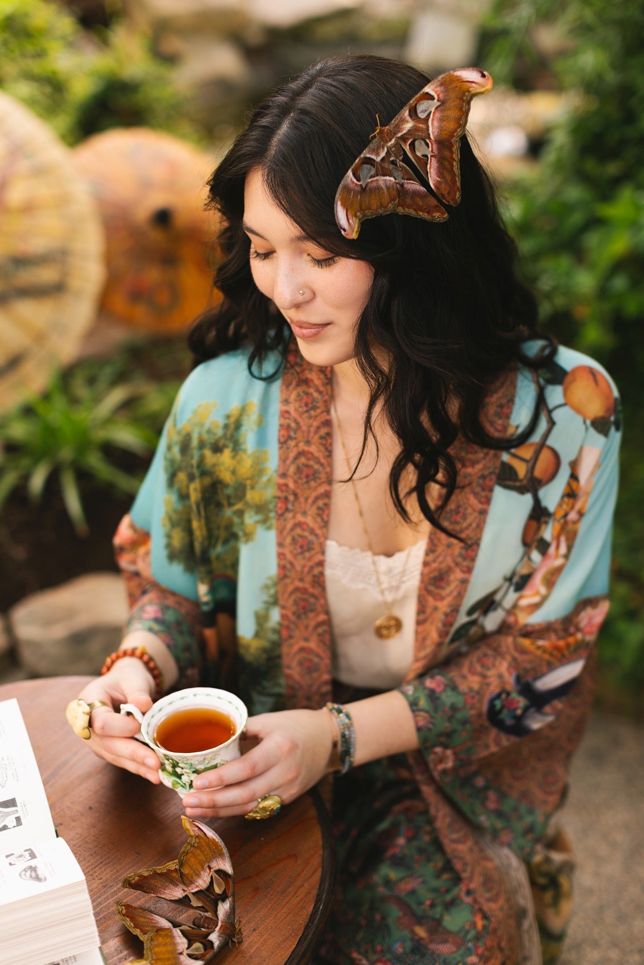 Model wearing Peace, Wine & Sunshine Bohéme Slip Dress featuring botanical collages and playful peace, wine and sunshine lettering on the hem – Market of Stars.