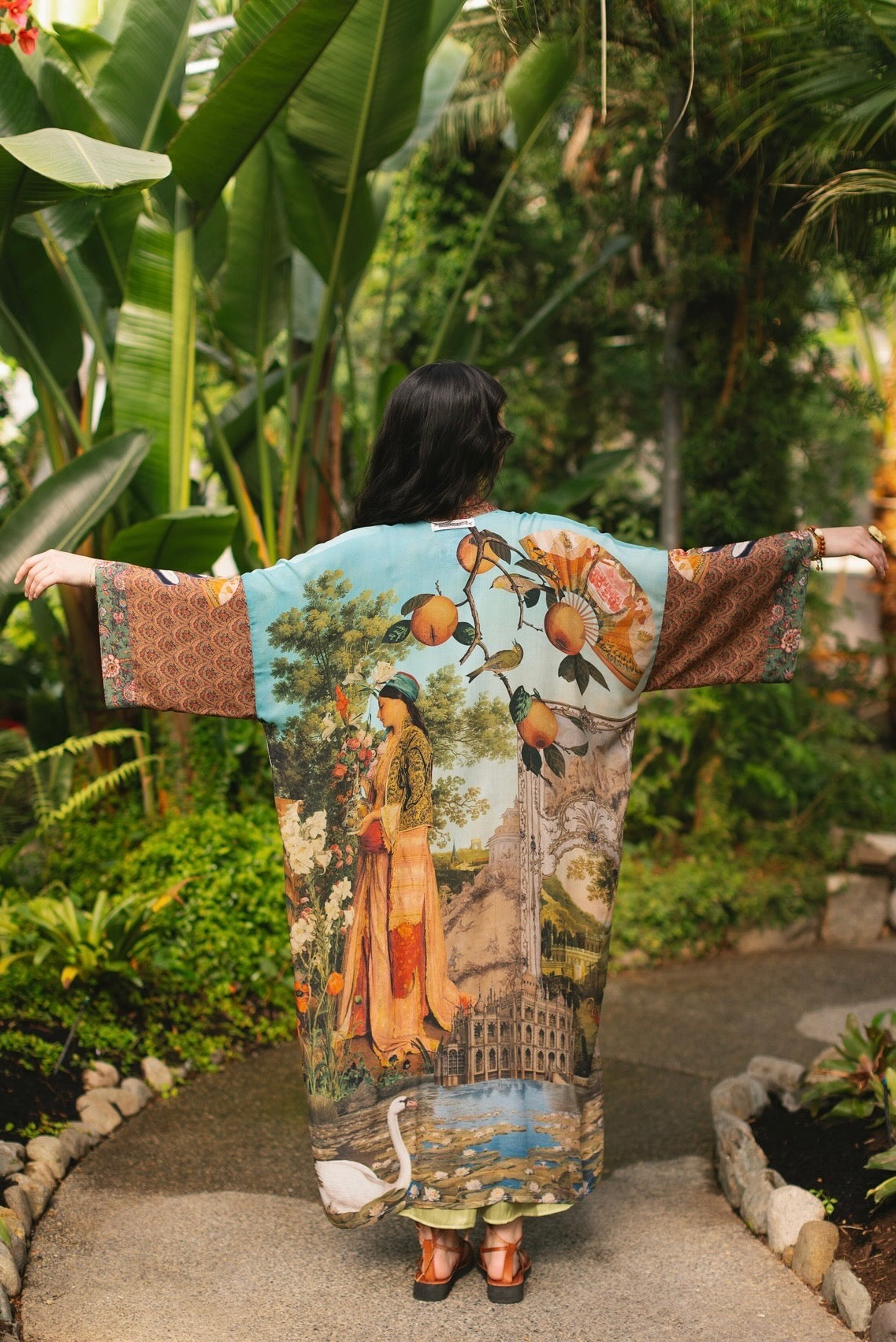 Model wearing Peace, Wine & Sunshine Bohéme Slip Dress featuring botanical collages and playful peace, wine and sunshine lettering on the hem – Market of Stars.
