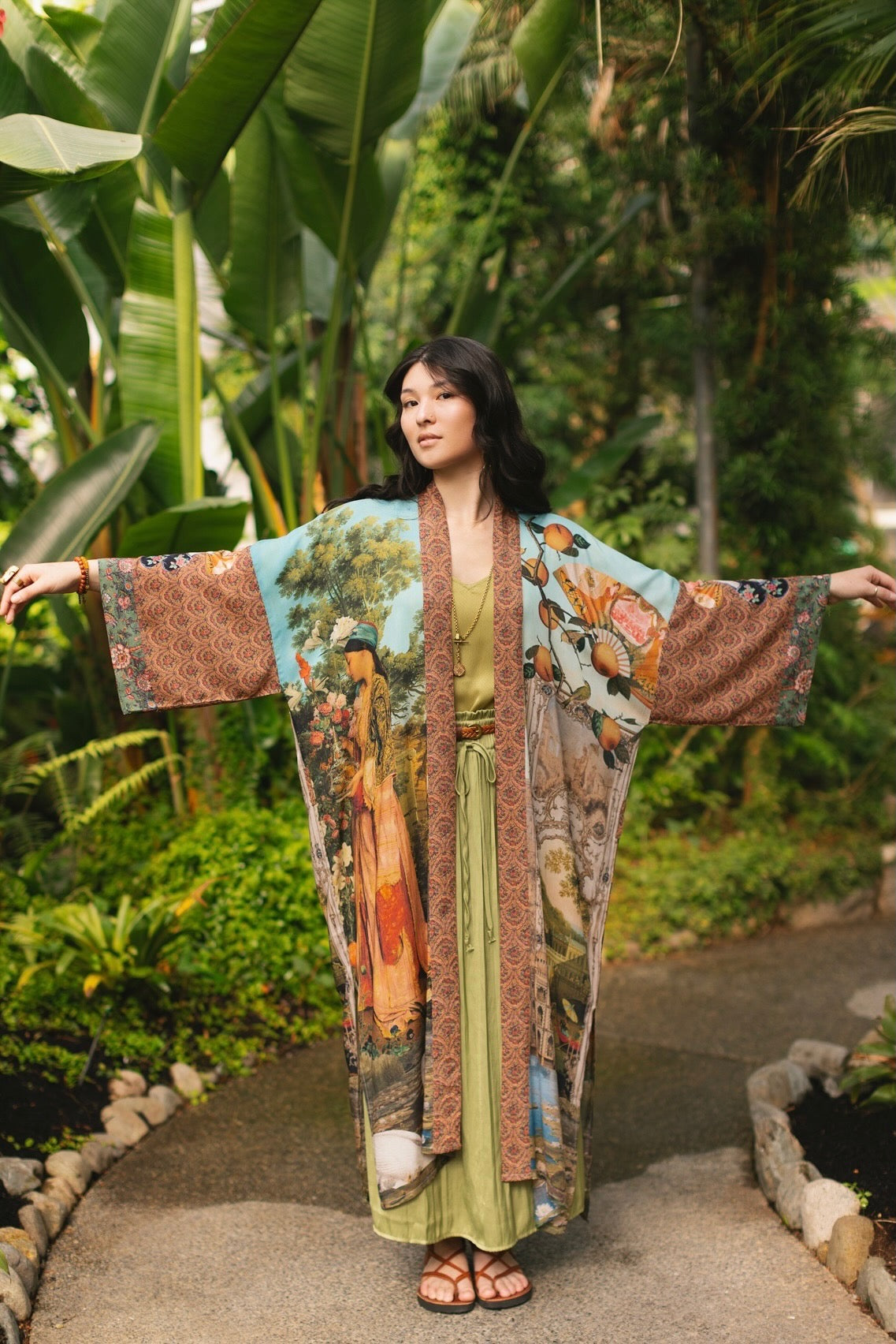 Model wearing Peace, Wine & Sunshine Bohéme Slip Dress featuring botanical collages and playful peace, wine and sunshine lettering on the hem – Market of Stars.