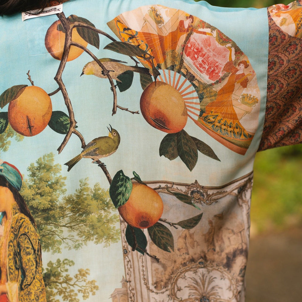 
                  
                    Model wearing Peace, Wine & Sunshine Bohéme Slip Dress featuring botanical collages and playful peace, wine and sunshine lettering on the hem – Market of Stars.
                  
                