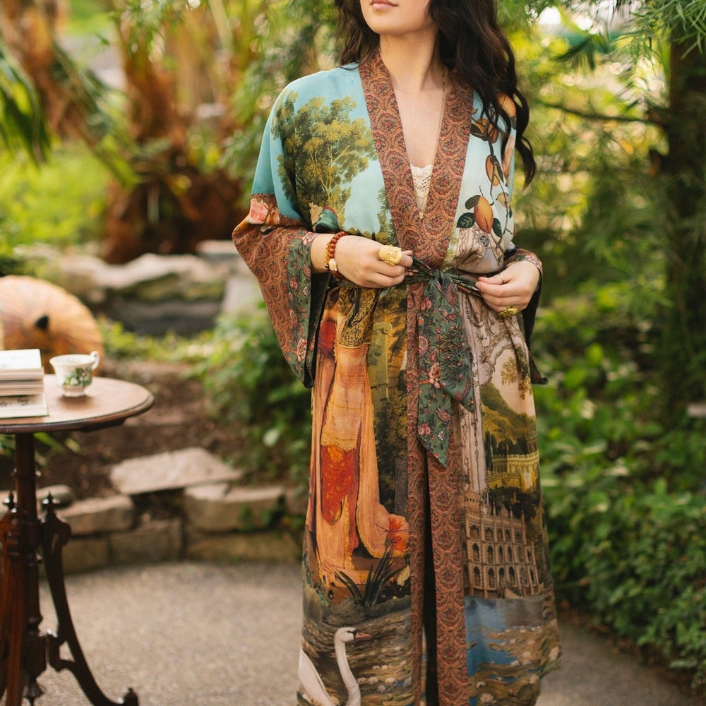 
                  
                    Model wearing Peace, Wine & Sunshine Bohéme Slip Dress featuring botanical collages and playful peace, wine and sunshine lettering on the hem – Market of Stars.
                  
                