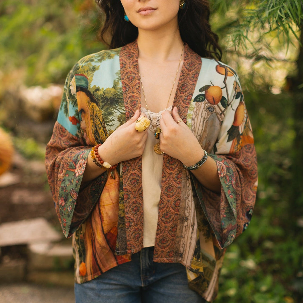
                  
                    Model wearing Peace, Wine & Sunshine Bohéme Slip Dress featuring botanical collages and playful peace, wine and sunshine lettering on the hem – Market of Stars.
                  
                