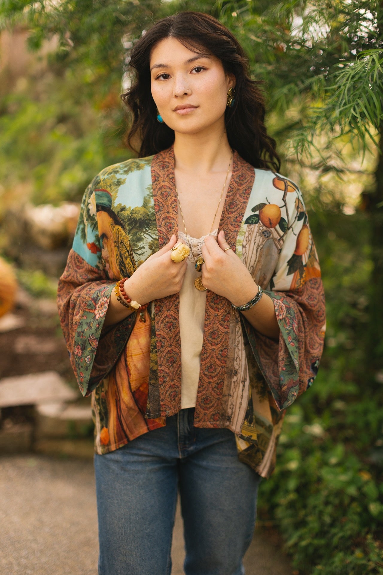 Model wearing Peace, Wine & Sunshine Bohéme Slip Dress featuring botanical collages and playful peace, wine and sunshine lettering on the hem – Market of Stars.