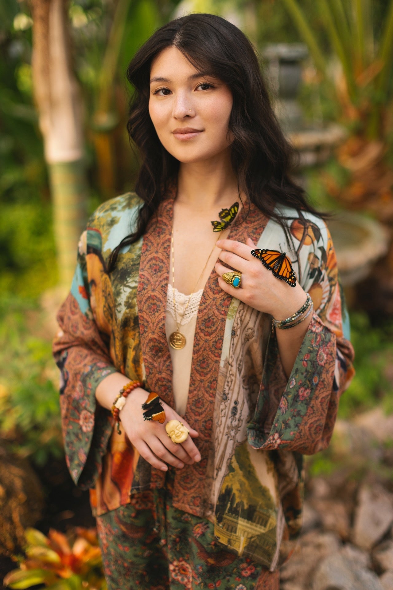 Model wearing Peace, Wine & Sunshine Bohéme Slip Dress featuring botanical collages and playful peace, wine and sunshine lettering on the hem – Market of Stars.