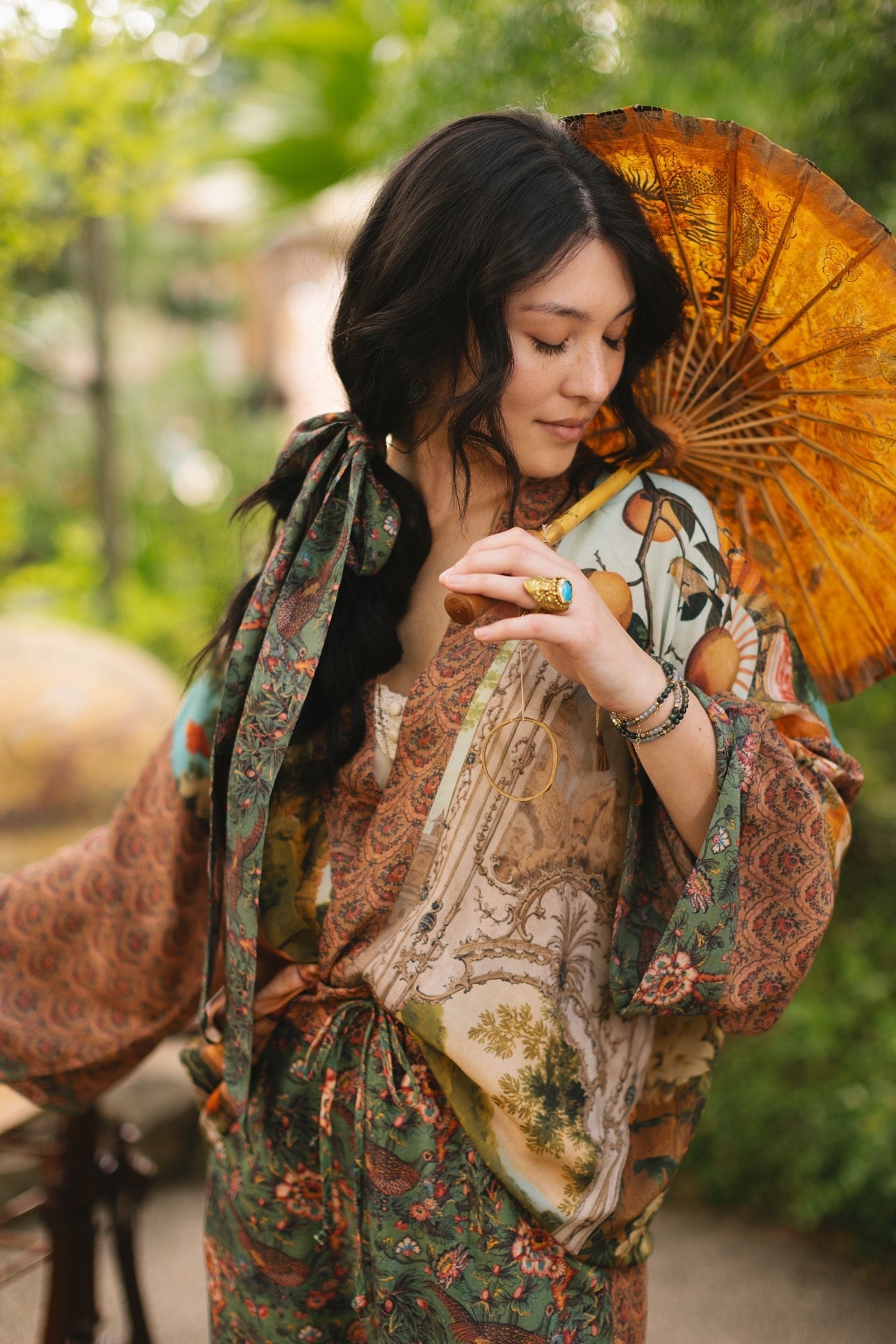 Model wearing Peace, Wine & Sunshine Bohéme Slip Dress featuring botanical collages and playful peace, wine and sunshine lettering on the hem – Market of Stars.
