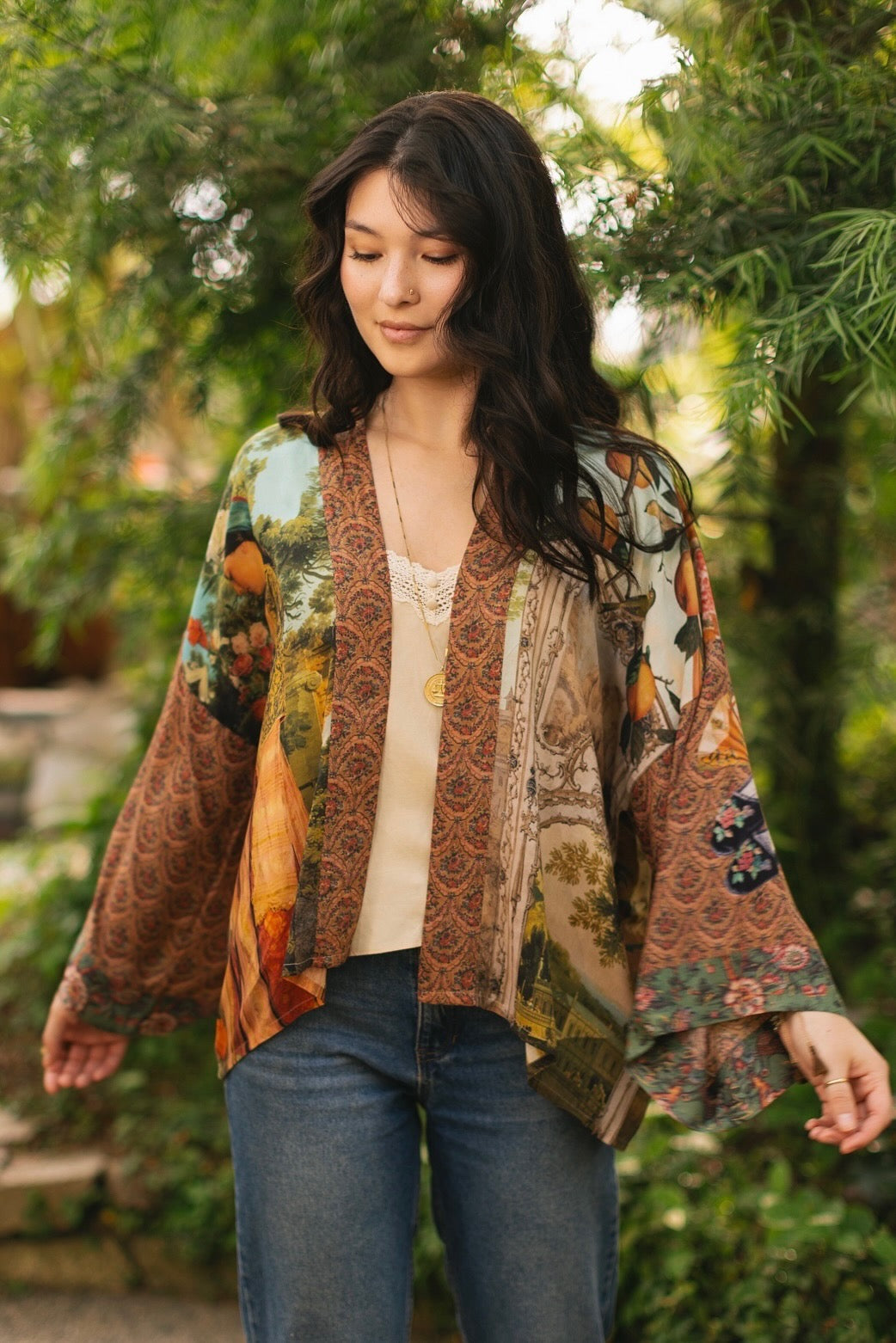 Model wearing Peace, Wine & Sunshine Bohéme Slip Dress featuring botanical collages and playful peace, wine and sunshine lettering on the hem – Market of Stars.
