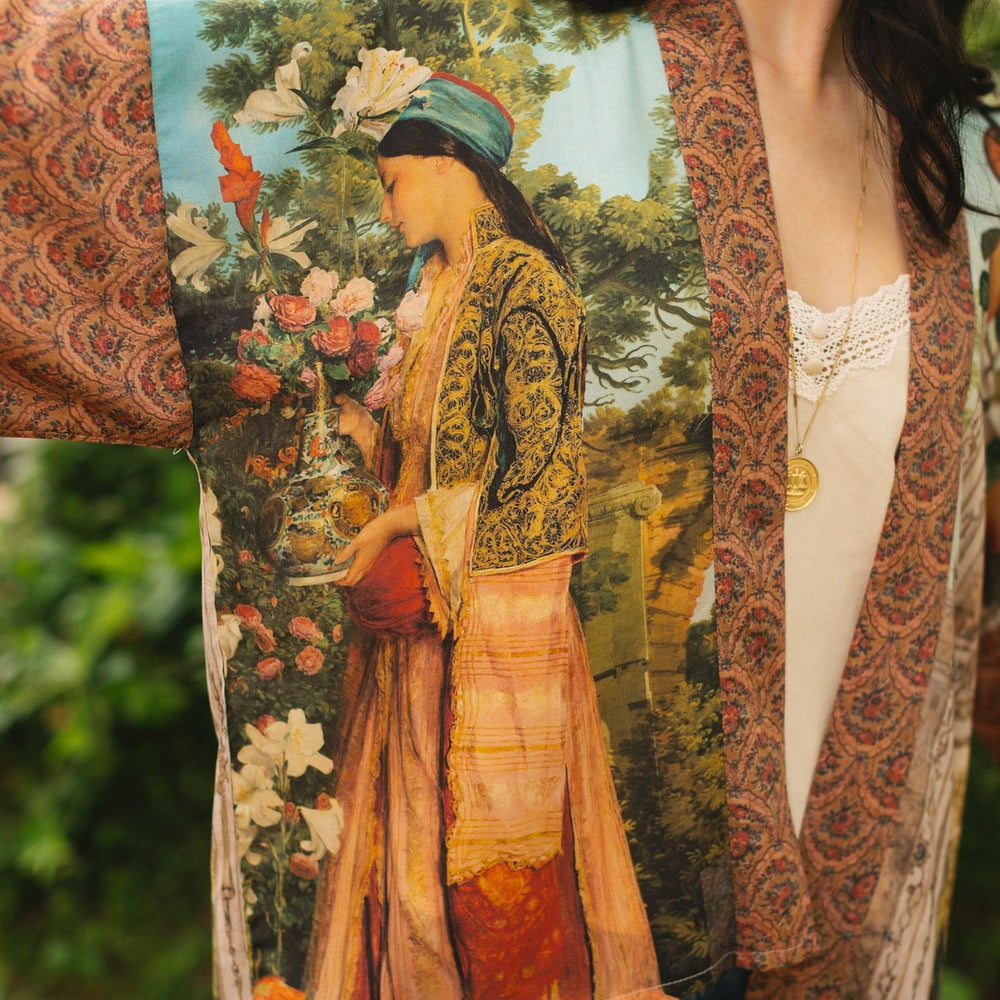 
                  
                    Model wearing Peace, Wine & Sunshine Bohéme Slip Dress featuring botanical collages and playful peace, wine and sunshine lettering on the hem – Market of Stars.
                  
                