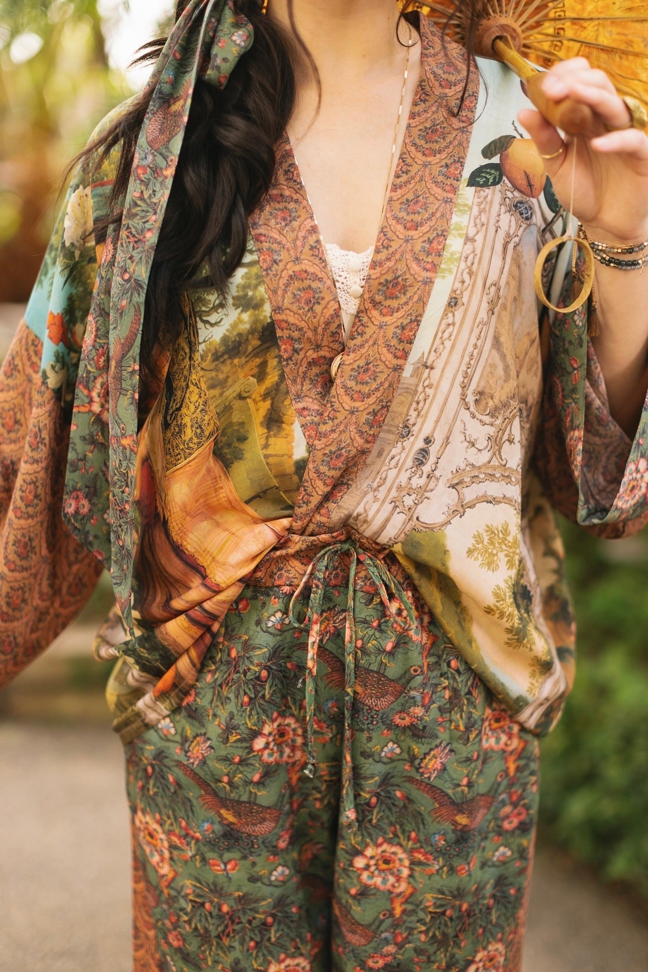Model wearing Peace, Wine & Sunshine Bohéme Slip Dress featuring botanical collages and playful peace, wine and sunshine lettering on the hem – Market of Stars.