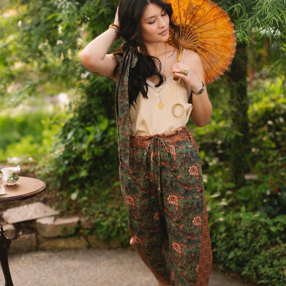 
                  
                    Model wearing Peace, Wine & Sunshine Bohéme Slip Dress featuring botanical collages and playful peace, wine and sunshine lettering on the hem – Market of Stars.
                  
                