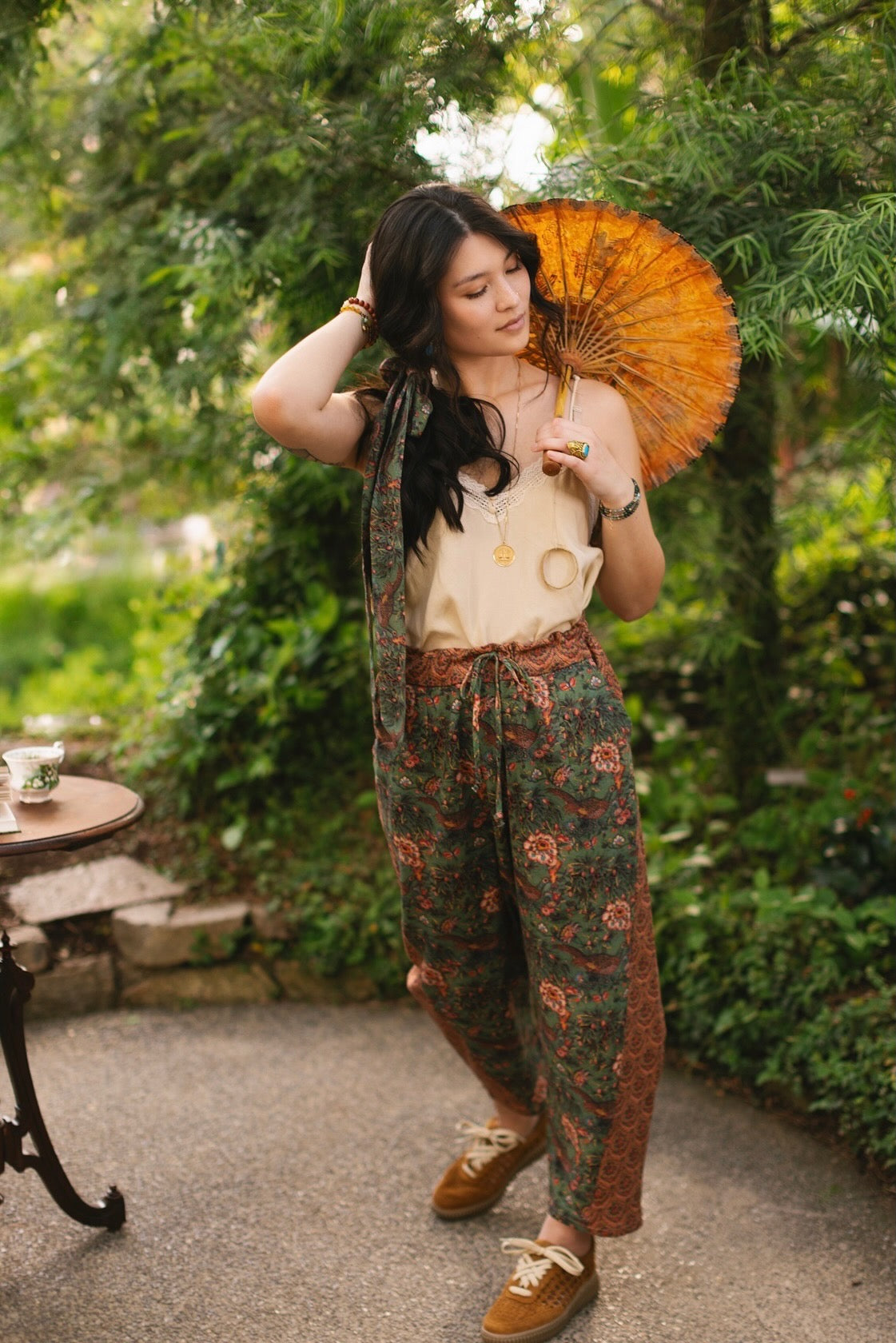 Model wearing Peace, Wine & Sunshine Bohéme Slip Dress featuring botanical collages and playful peace, wine and sunshine lettering on the hem – Market of Stars.