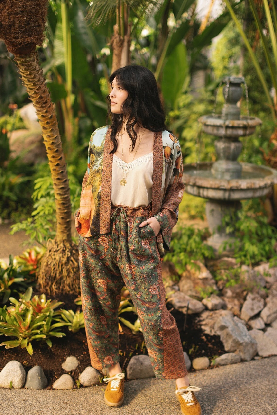 Model wearing Peace, Wine & Sunshine Bohéme Slip Dress featuring botanical collages and playful peace, wine and sunshine lettering on the hem – Market of Stars.