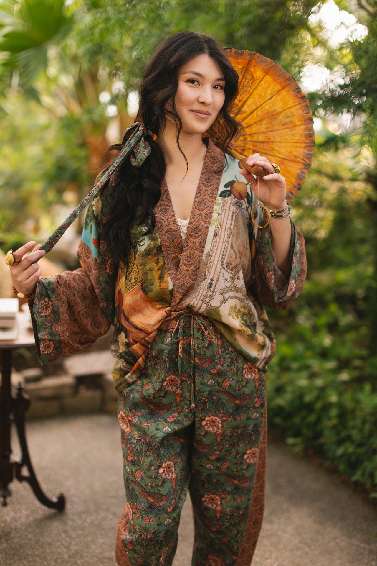 Model wearing Peace, Wine & Sunshine Bohéme Slip Dress featuring botanical collages and playful peace, wine and sunshine lettering on the hem – Market of Stars.