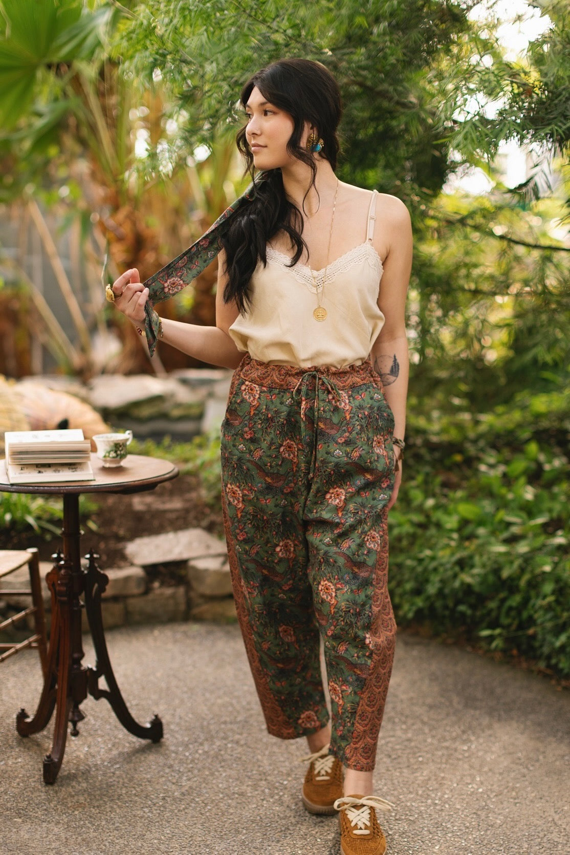 Model wearing Peace, Wine & Sunshine Bohéme Slip Dress featuring botanical collages and playful peace, wine and sunshine lettering on the hem – Market of Stars.