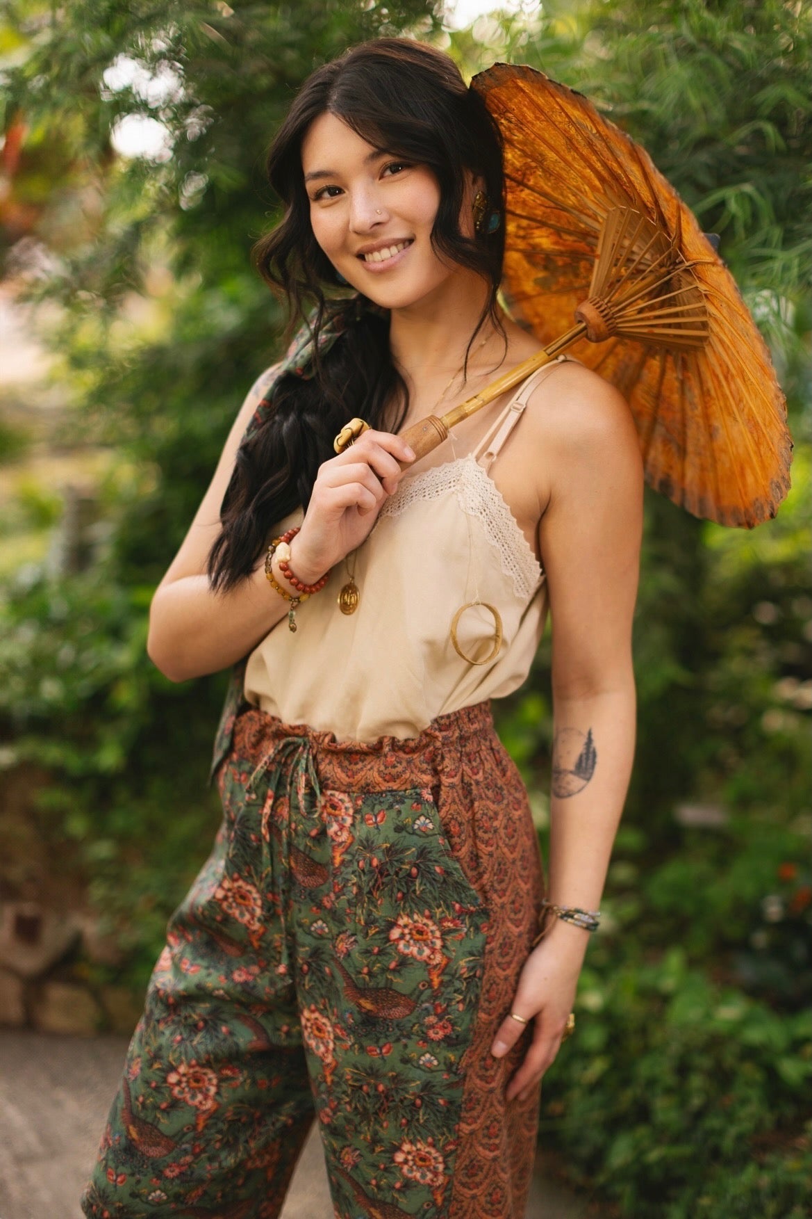 Model wearing Peace, Wine & Sunshine Bohéme Slip Dress featuring botanical collages and playful peace, wine and sunshine lettering on the hem – Market of Stars.