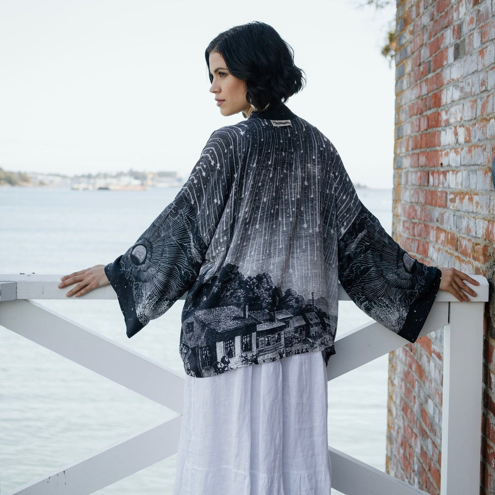 
                  
                    Model wearing our Stargazer cropped kimono featuring an antique engraving of a meteor shower and moonlit astronomy imagery – Market of Stars
                  
                