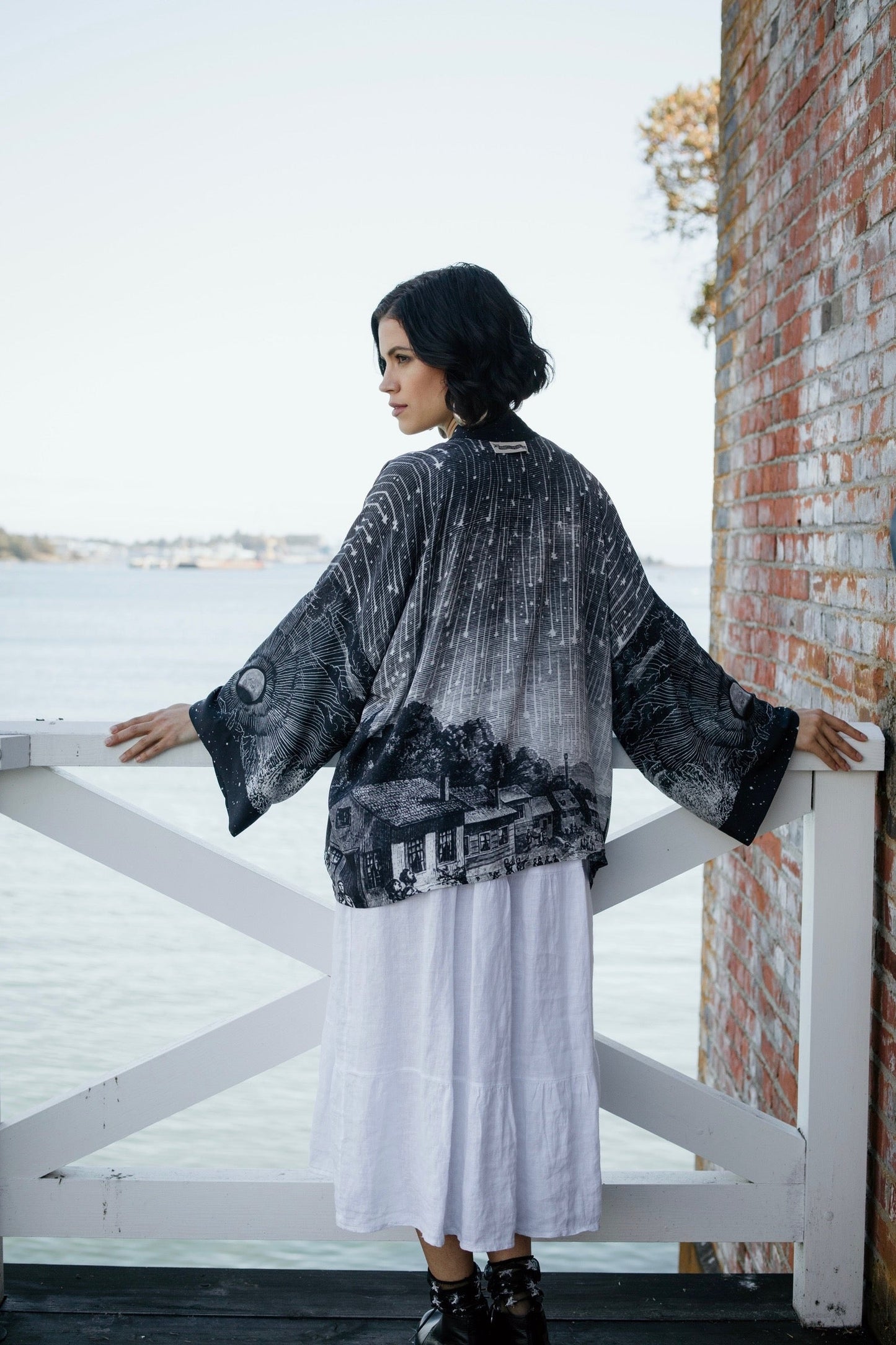 Model wearing our Stargazer cropped kimono featuring an antique engraving of a meteor shower and moonlit astronomy imagery – Market of Stars