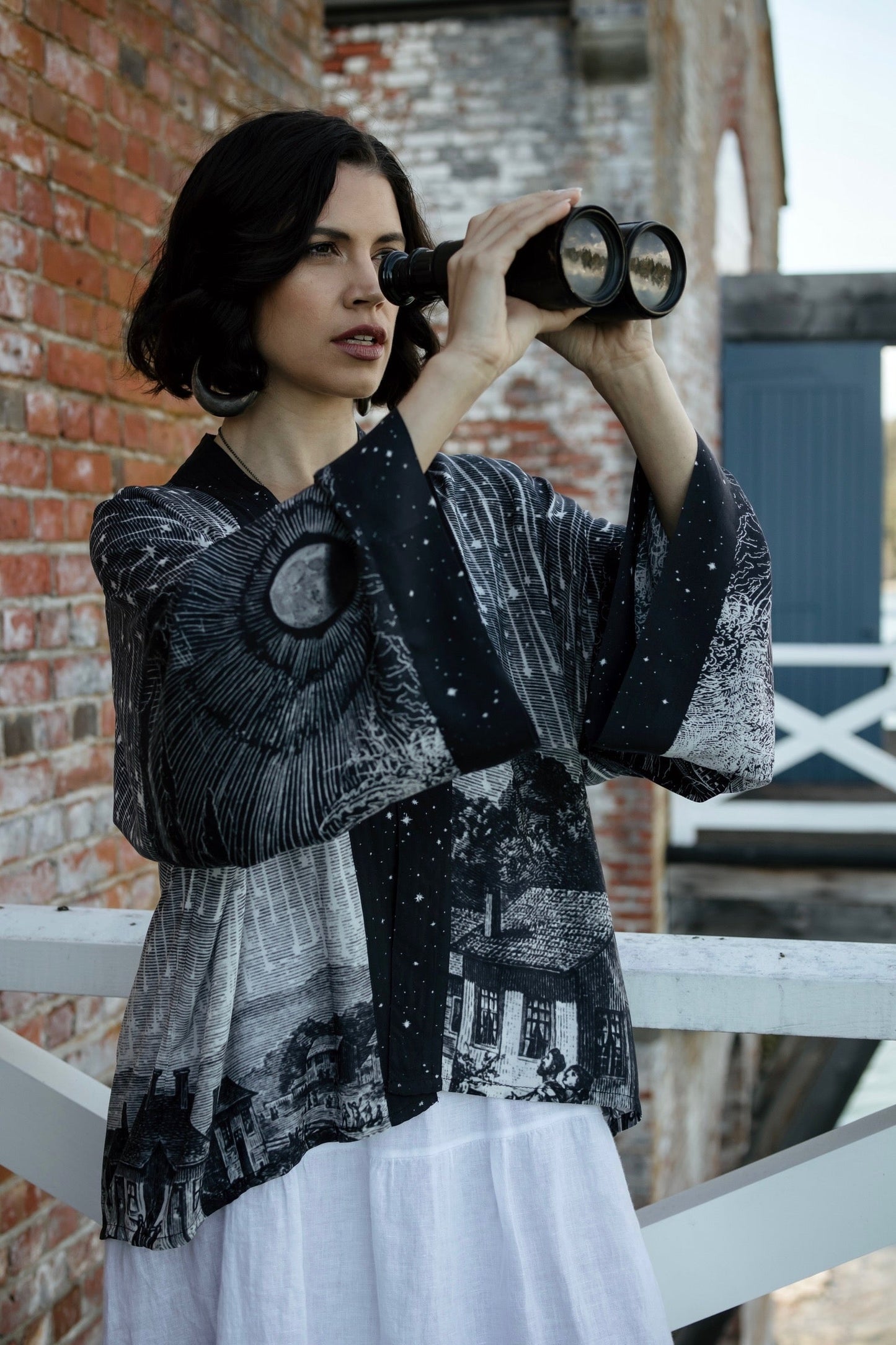 Model wearing our Stargazer cropped kimono featuring an antique engraving of a meteor shower and moonlit astronomy imagery – Market of Stars