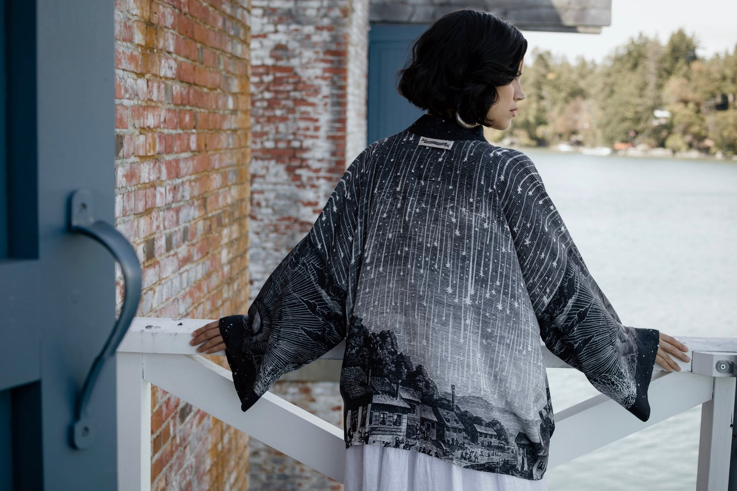 Model wearing our Stargazer cropped kimono featuring an antique engraving of a meteor shower and moonlit astronomy imagery – Market of Stars
