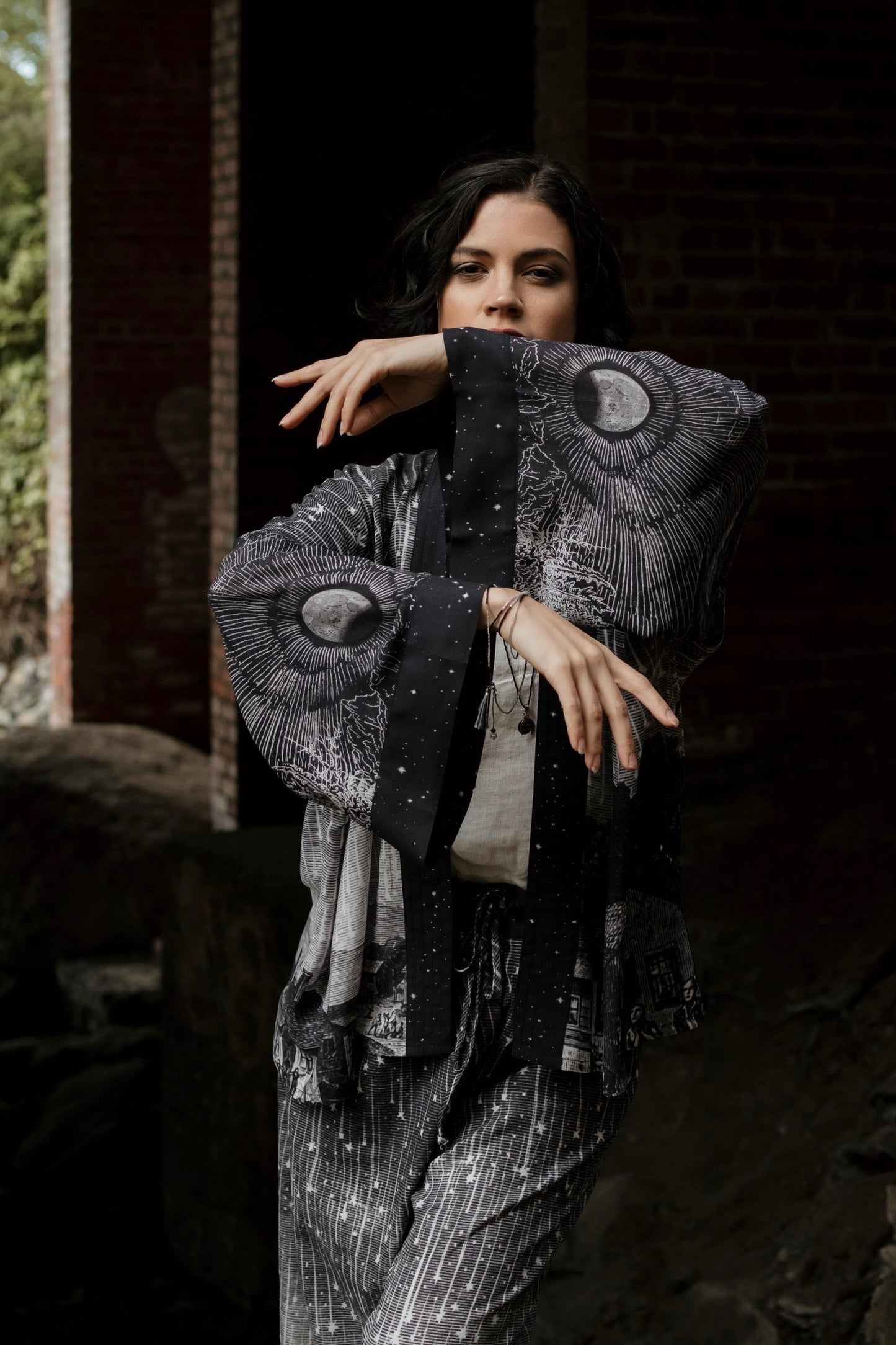 Model wearing our Stargazer cropped kimono featuring an antique engraving of a meteor shower and moonlit astronomy imagery – Market of Stars