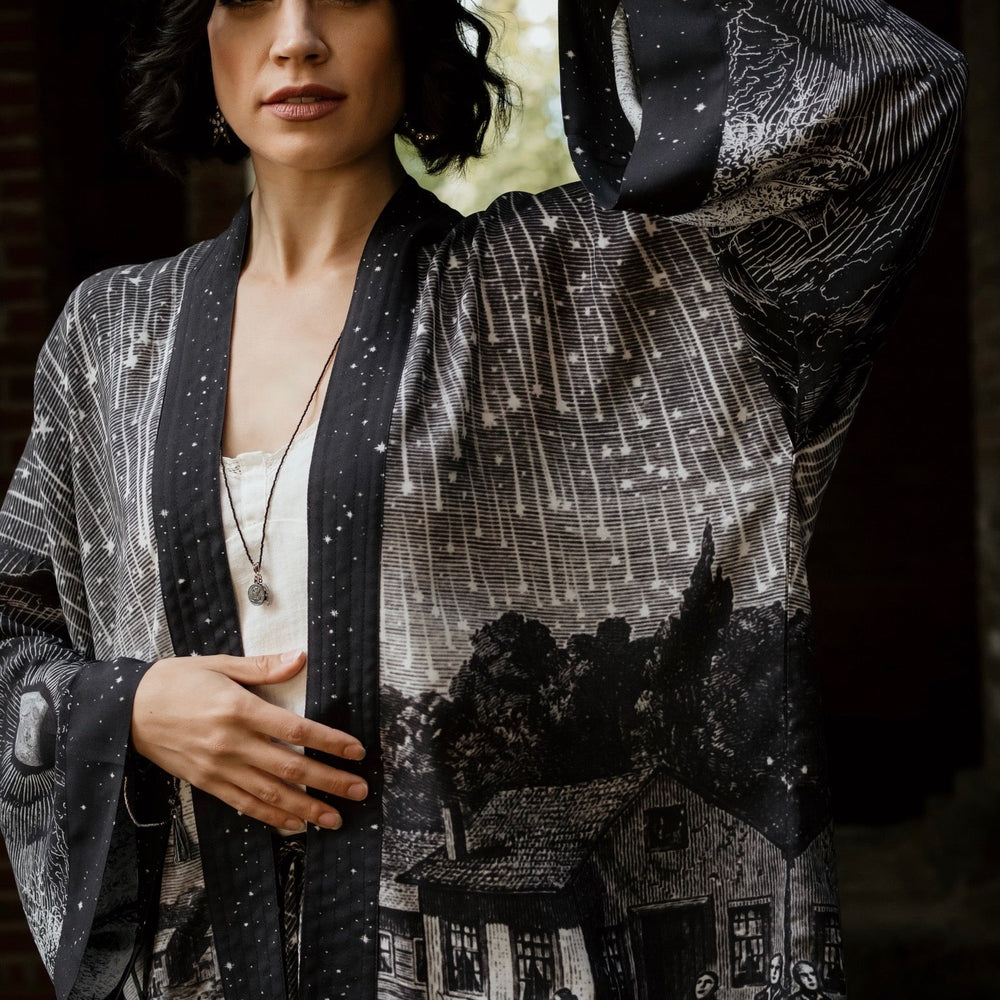 
                  
                    Model wearing our Stargazer cropped kimono featuring an antique engraving of a meteor shower and moonlit astronomy imagery – Market of Stars
                  
                