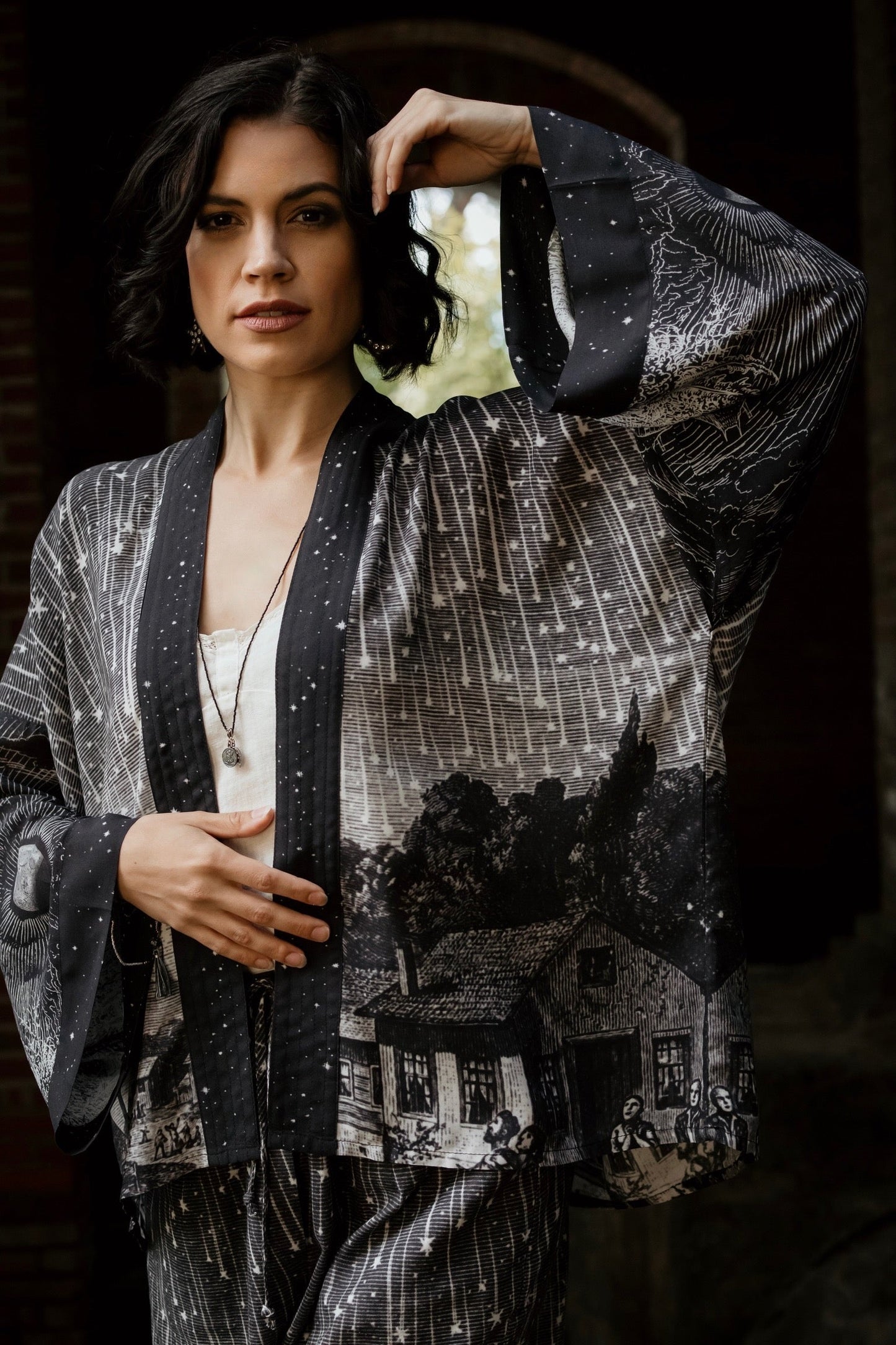Model wearing our Stargazer cropped kimono featuring an antique engraving of a meteor shower and moonlit astronomy imagery – Market of Stars