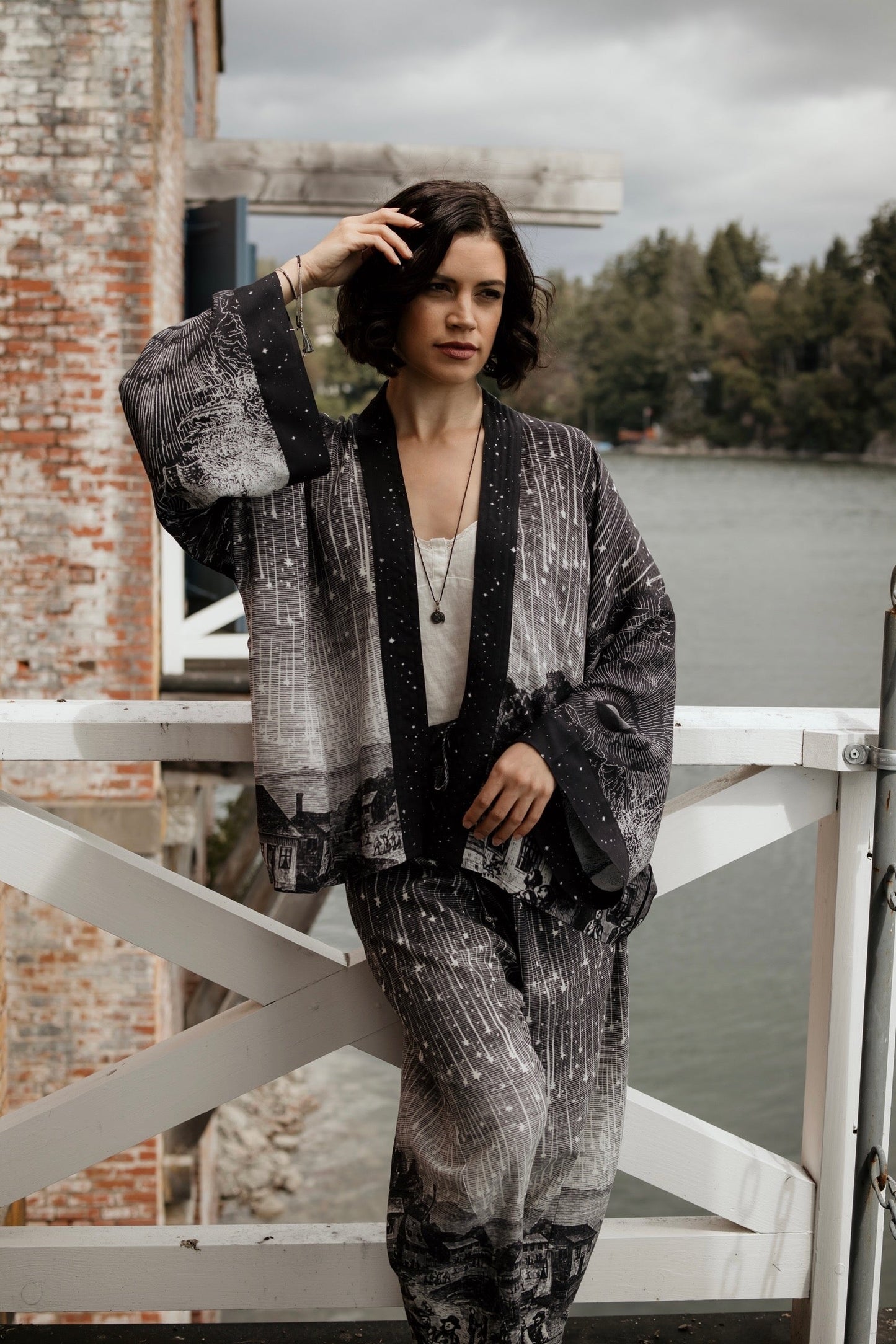 Model wearing our Stargazer cropped kimono featuring an antique engraving of a meteor shower and moonlit astronomy imagery – Market of Stars