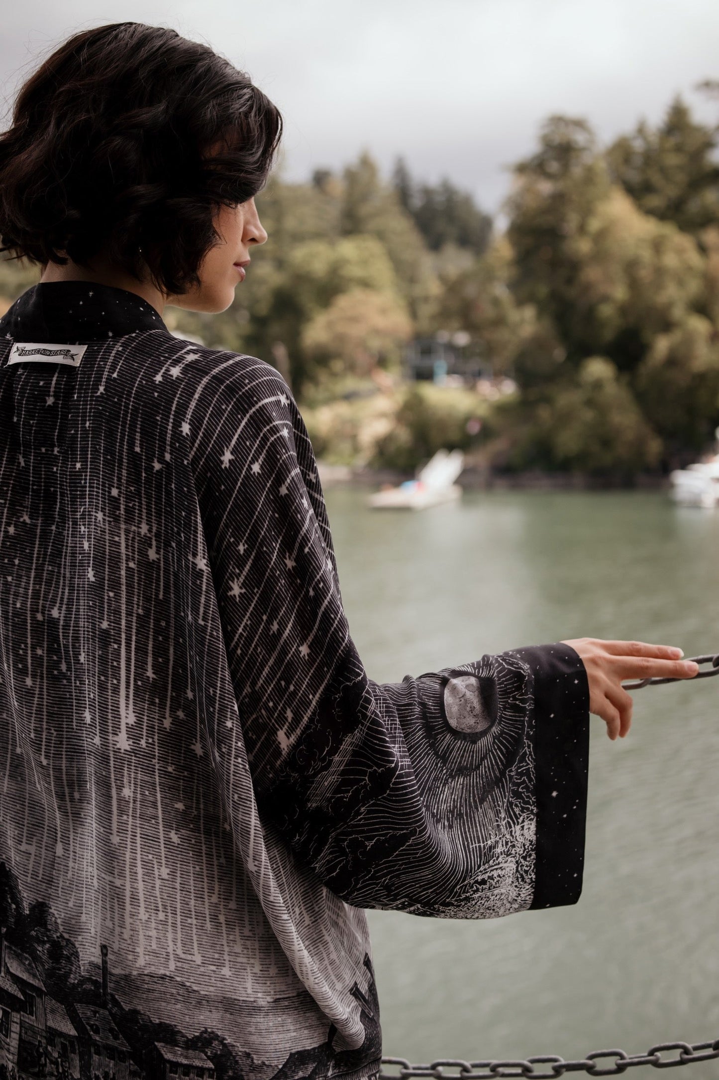 Model wearing our Stargazer cropped kimono featuring an antique engraving of a meteor shower and moonlit astronomy imagery – Market of Stars