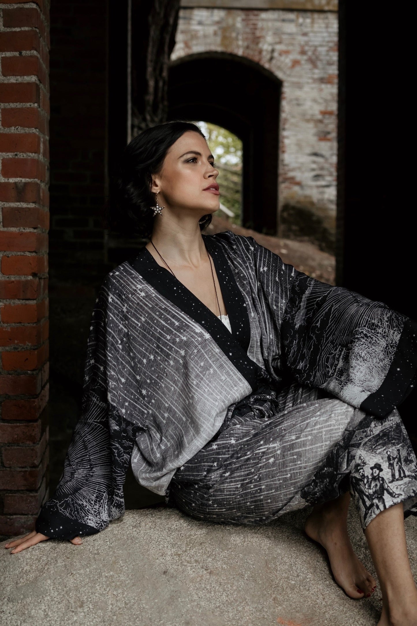 Model wearing our Stargazer cropped kimono featuring an antique engraving of a meteor shower and moonlit astronomy imagery – Market of Stars