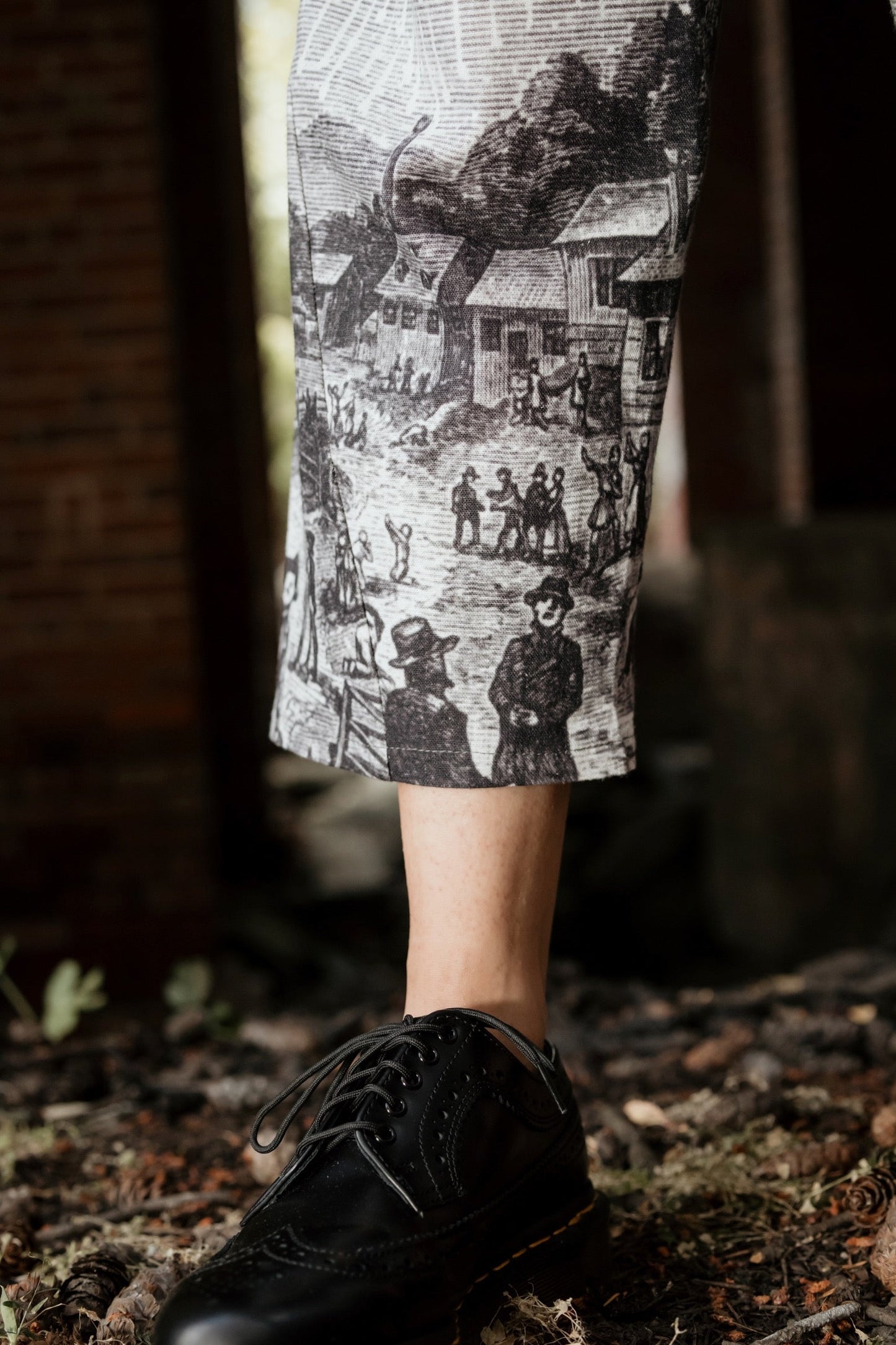 Model wearing Peace, Wine & Sunshine Bohéme Slip Dress featuring botanical collages and playful peace, wine and sunshine lettering on the hem – Market of Stars.