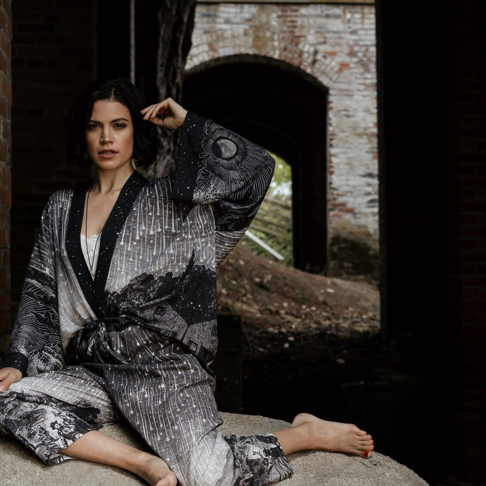 
                  
                    Model wearing Peace, Wine & Sunshine Bohéme Slip Dress featuring botanical collages and playful peace, wine and sunshine lettering on the hem – Market of Stars.
                  
                
