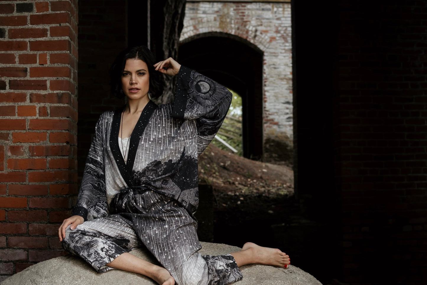 Model wearing Peace, Wine & Sunshine Bohéme Slip Dress featuring botanical collages and playful peace, wine and sunshine lettering on the hem – Market of Stars.