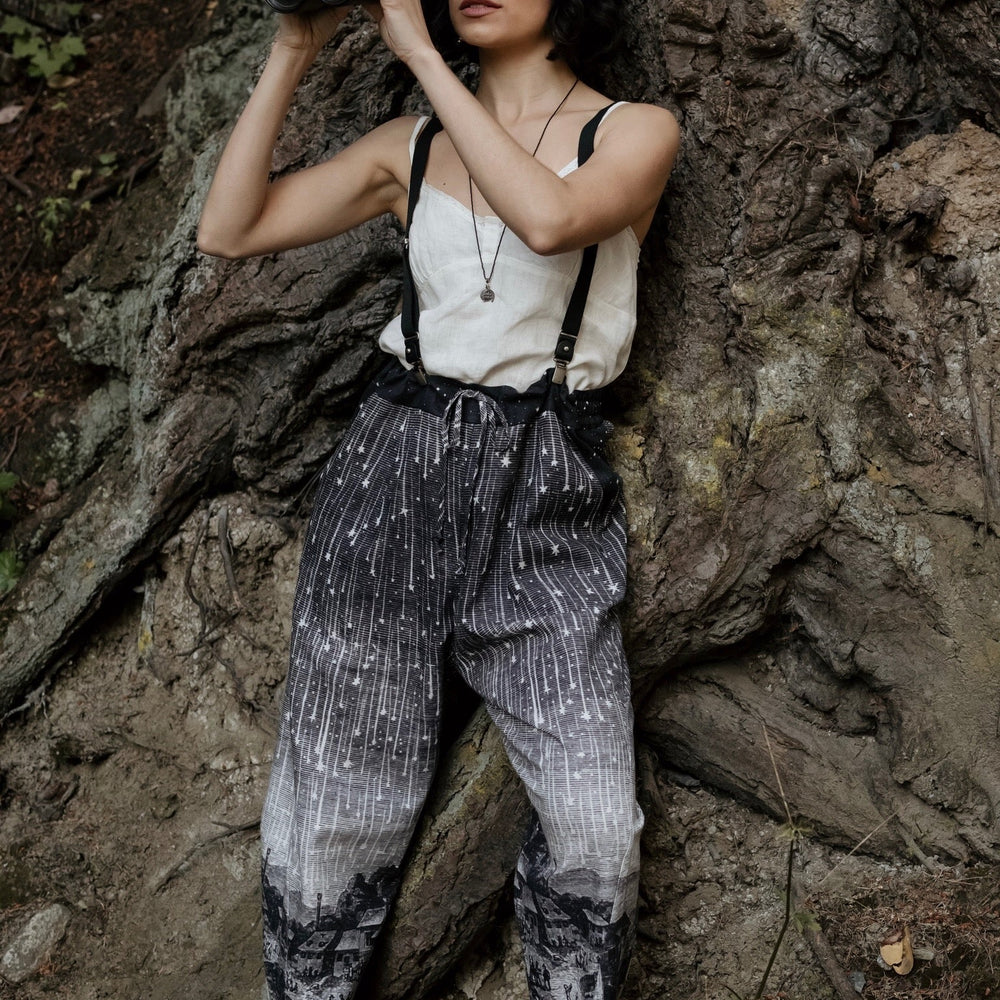 
                  
                    Model wearing Peace, Wine & Sunshine Bohéme Slip Dress featuring botanical collages and playful peace, wine and sunshine lettering on the hem – Market of Stars.
                  
                