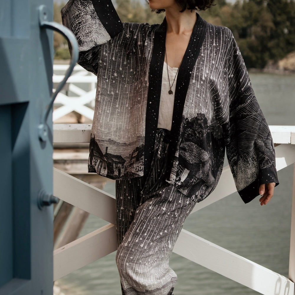 
                  
                    Model wearing Peace, Wine & Sunshine Bohéme Slip Dress featuring botanical collages and playful peace, wine and sunshine lettering on the hem – Market of Stars.
                  
                