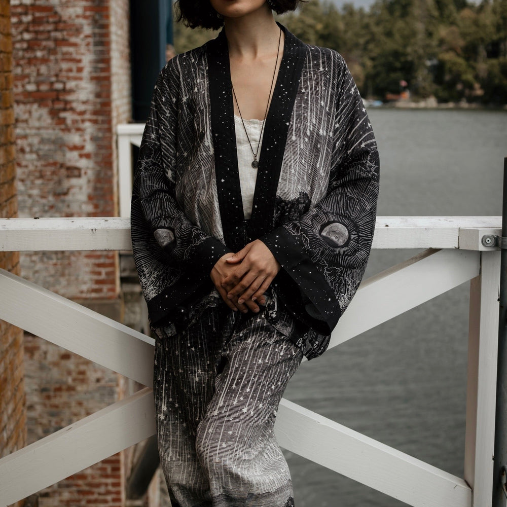 
                  
                    Model wearing Peace, Wine & Sunshine Bohéme Slip Dress featuring botanical collages and playful peace, wine and sunshine lettering on the hem – Market of Stars.
                  
                
