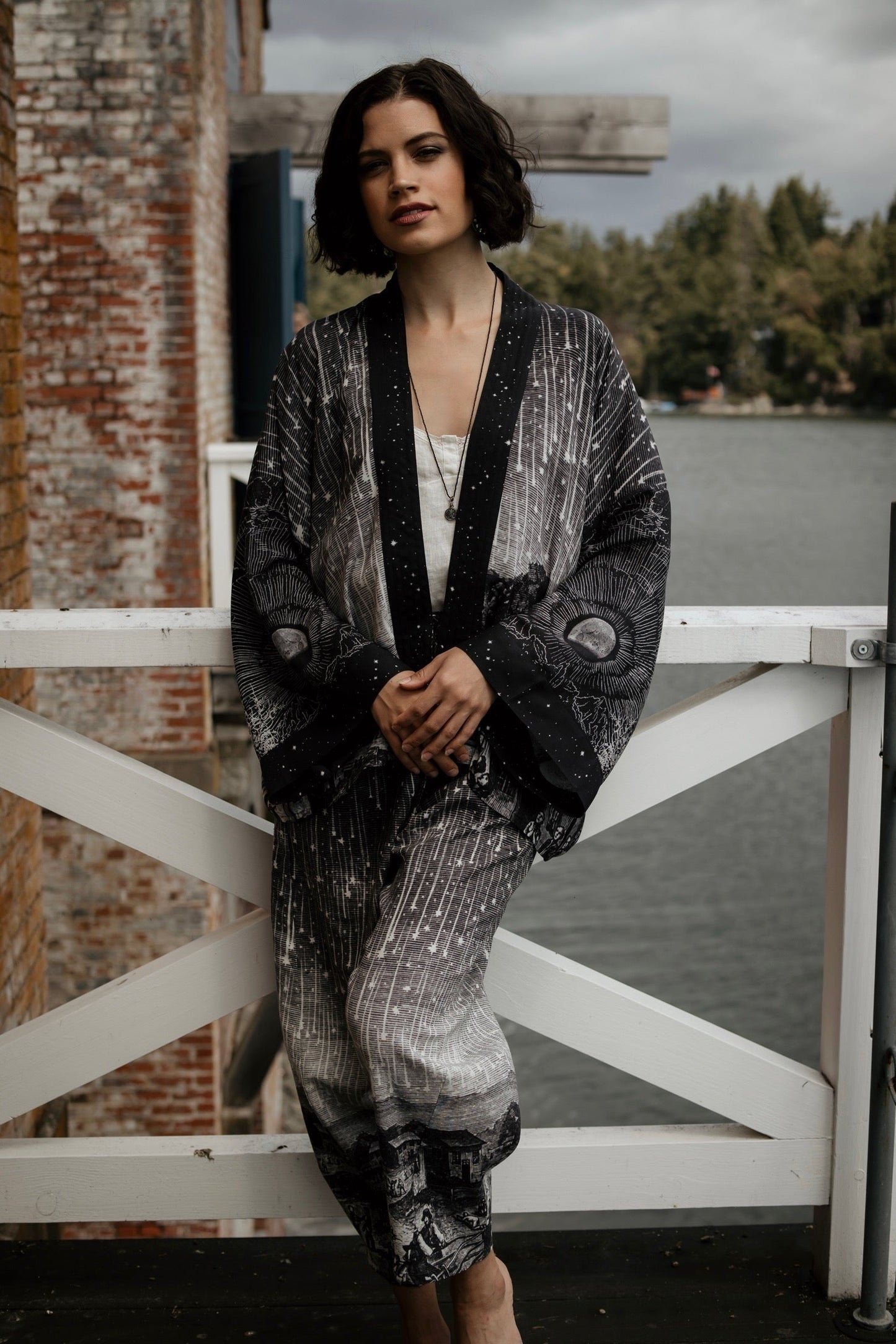 Model wearing Peace, Wine & Sunshine Bohéme Slip Dress featuring botanical collages and playful peace, wine and sunshine lettering on the hem – Market of Stars.