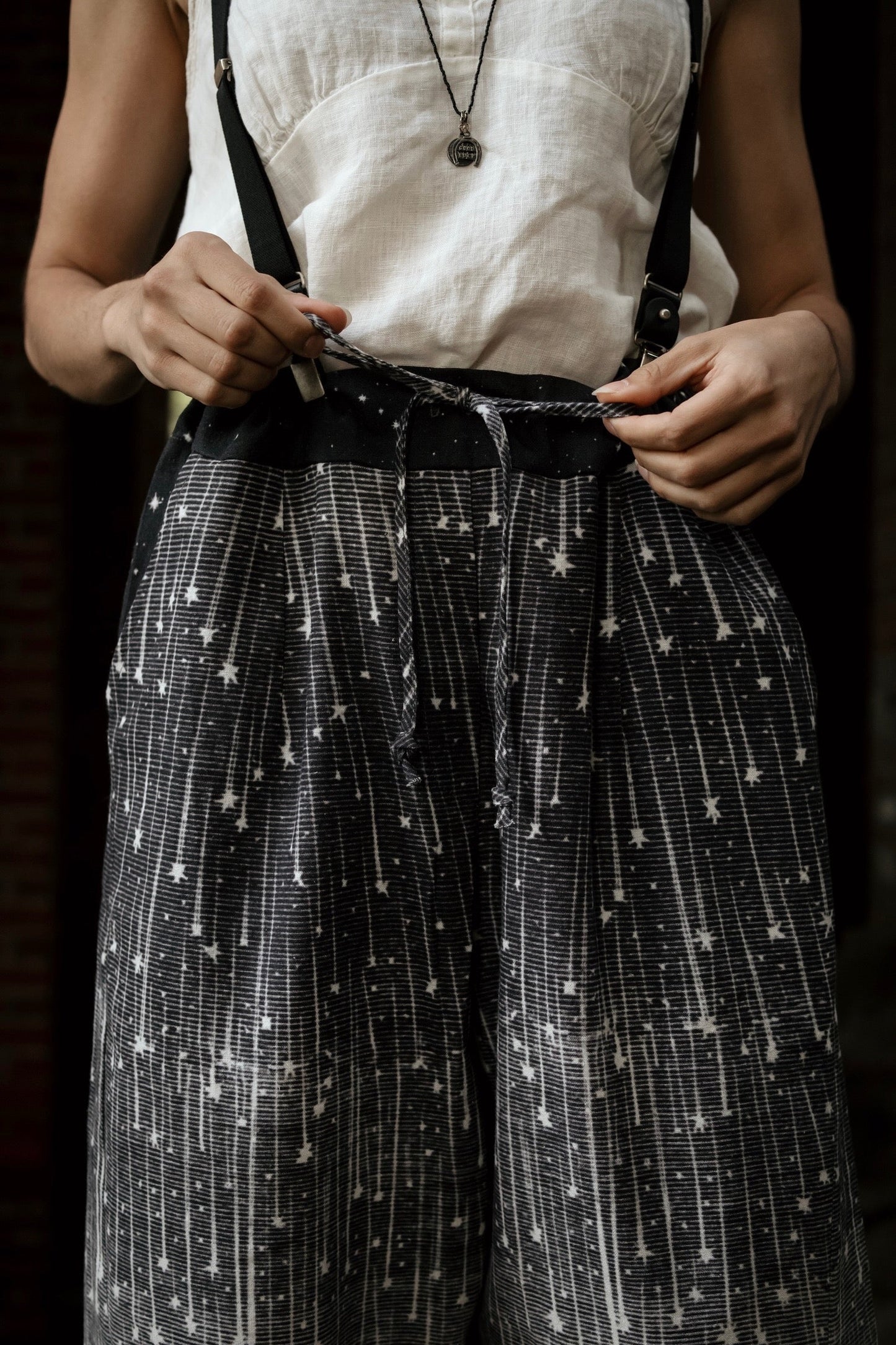 Model wearing Peace, Wine & Sunshine Bohéme Slip Dress featuring botanical collages and playful peace, wine and sunshine lettering on the hem – Market of Stars.