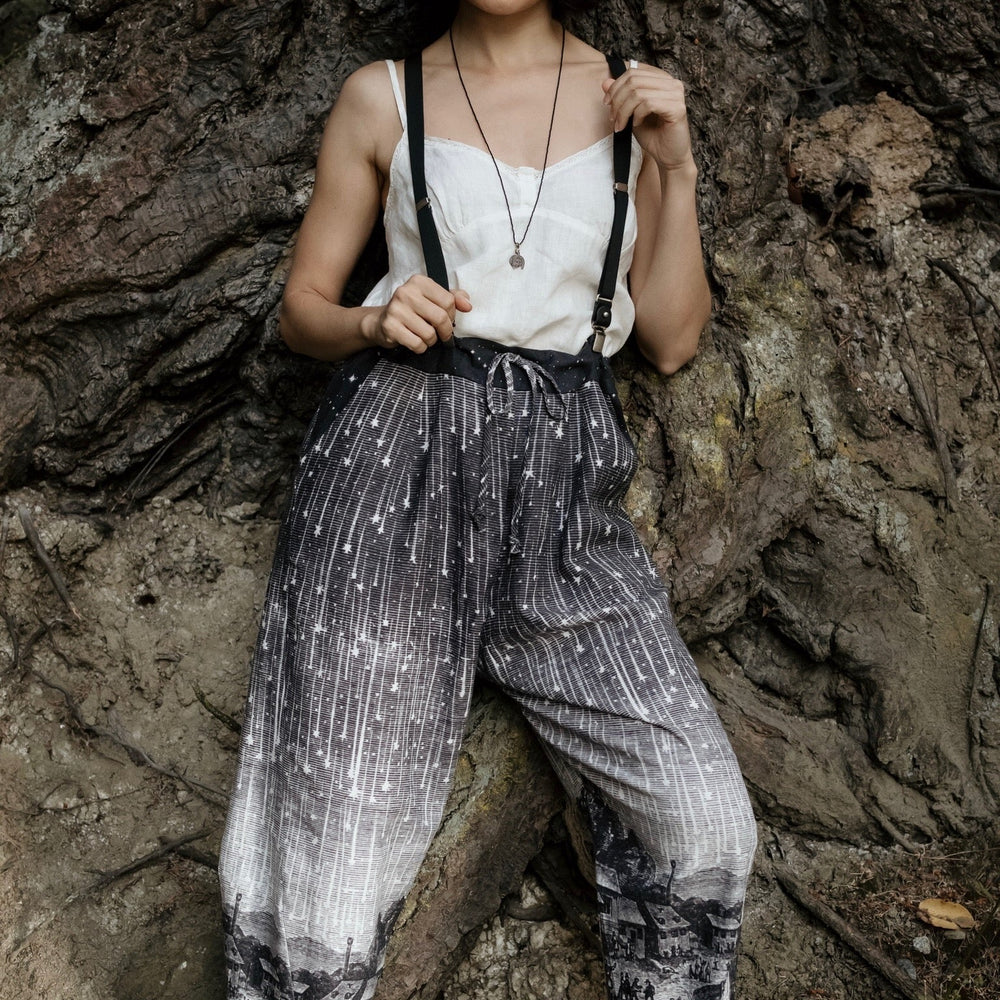 
                  
                    Model wearing Peace, Wine & Sunshine Bohéme Slip Dress featuring botanical collages and playful peace, wine and sunshine lettering on the hem – Market of Stars.
                  
                