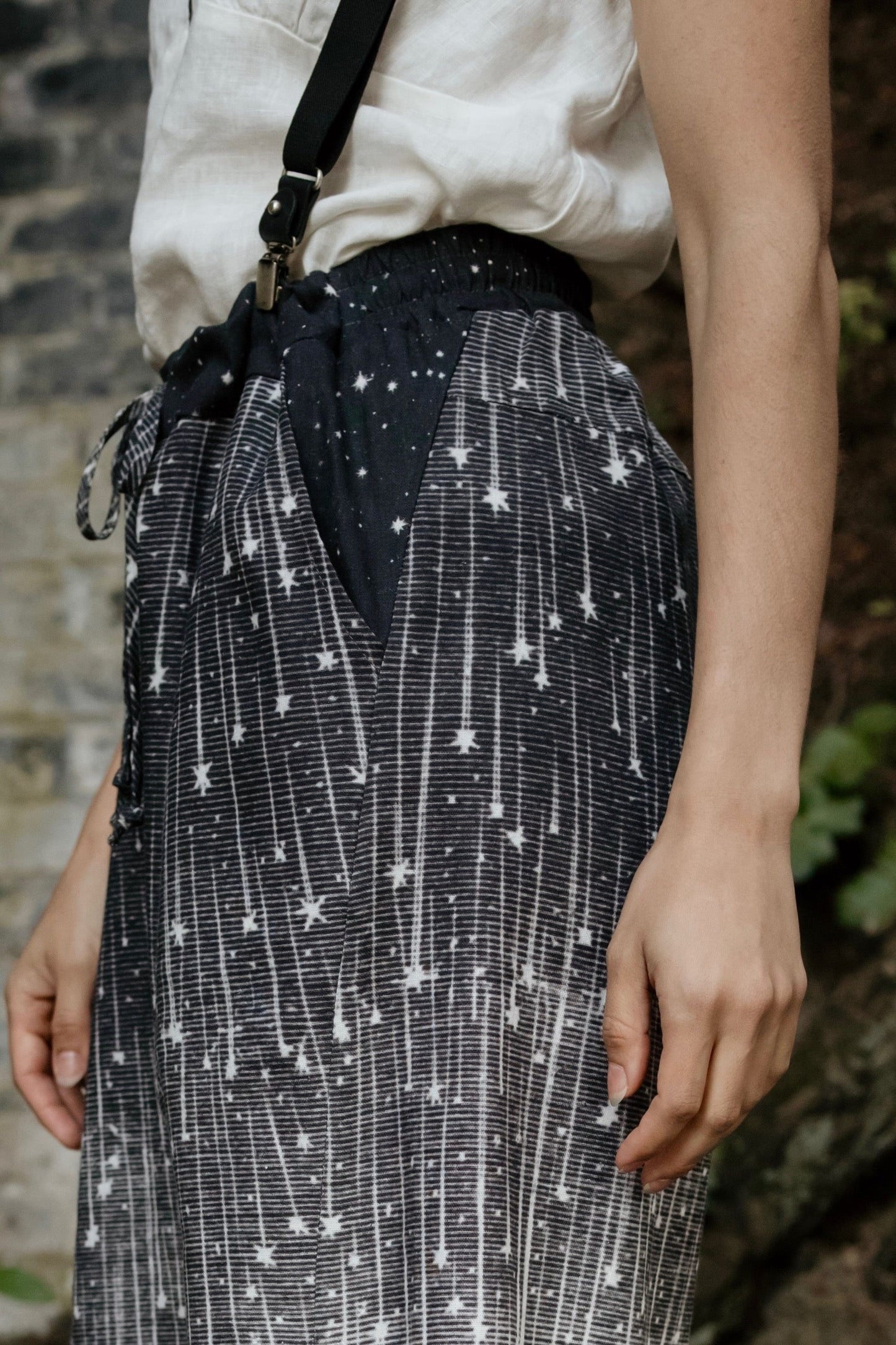 Model wearing Peace, Wine & Sunshine Bohéme Slip Dress featuring botanical collages and playful peace, wine and sunshine lettering on the hem – Market of Stars.