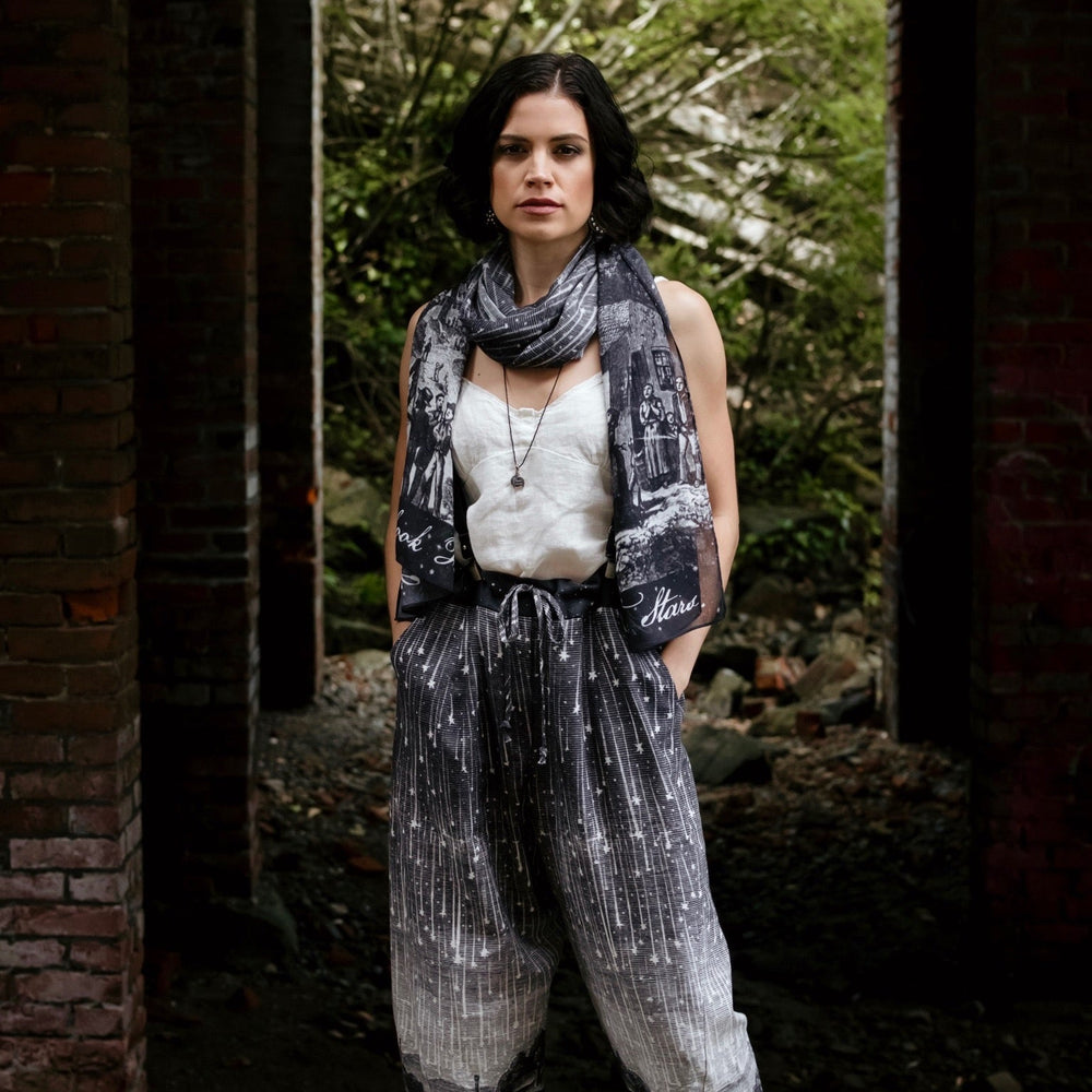 
                  
                    Model wearing Peace, Wine & Sunshine Bohéme Slip Dress featuring botanical collages and playful peace, wine and sunshine lettering on the hem – Market of Stars.
                  
                