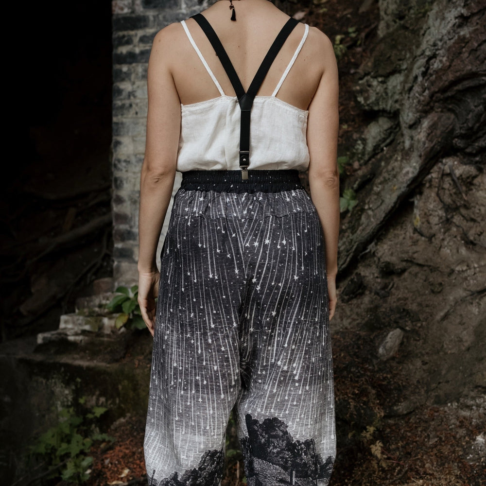 
                  
                    Model wearing Peace, Wine & Sunshine Bohéme Slip Dress featuring botanical collages and playful peace, wine and sunshine lettering on the hem – Market of Stars.
                  
                