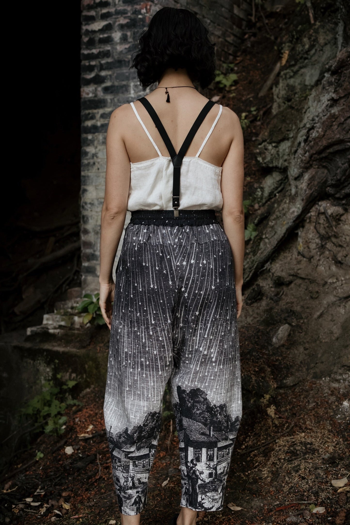 Model wearing Peace, Wine & Sunshine Bohéme Slip Dress featuring botanical collages and playful peace, wine and sunshine lettering on the hem – Market of Stars.