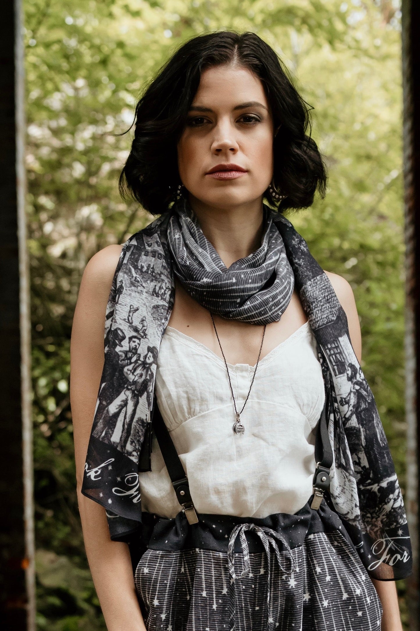 Model wearing the Stargazer Scarf featuring antique night sky illustrations and the quote "When it's dark, look for stars" – Market of Stars