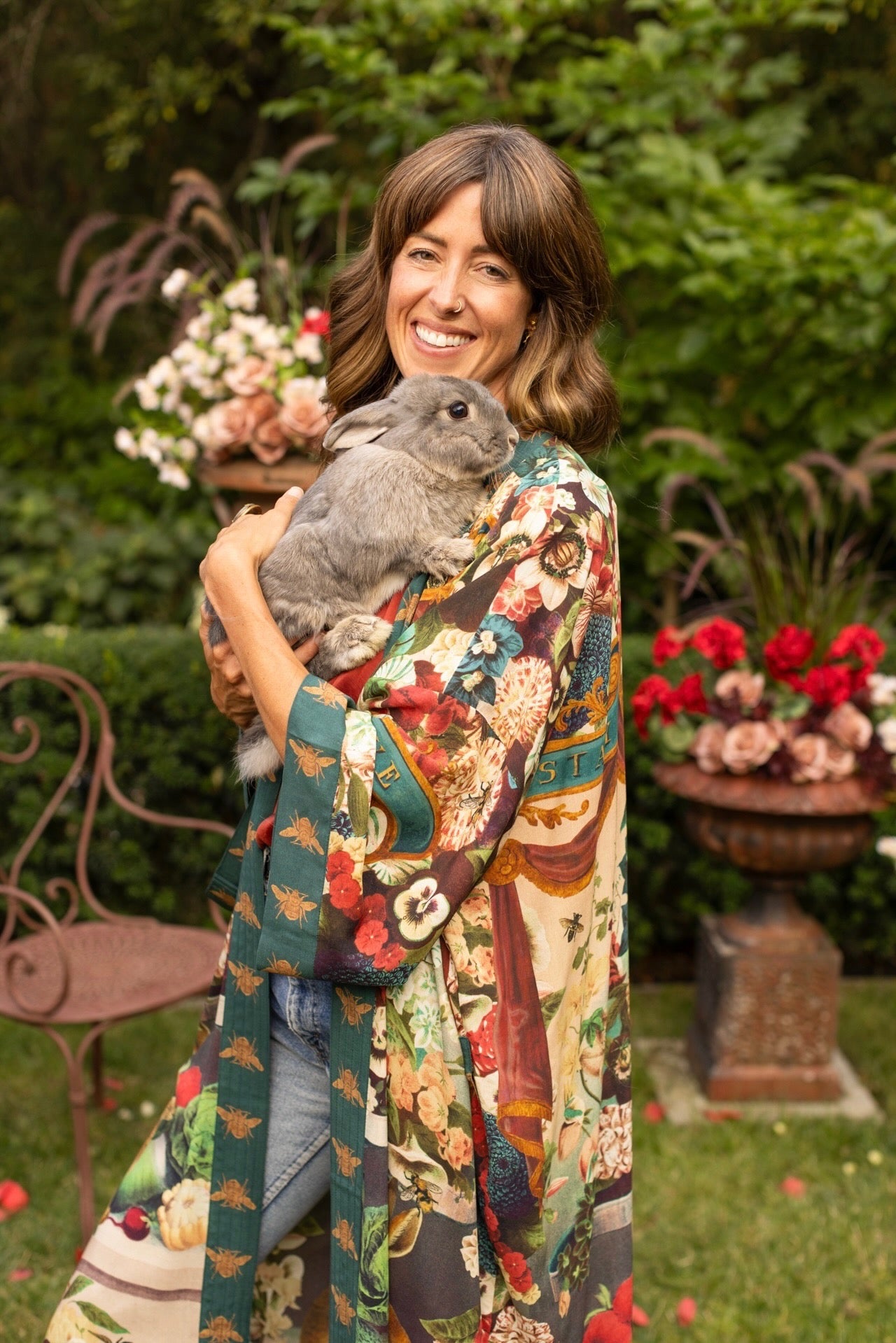 Model wearing Stay Gold Opera Duster with wildflower, bee, and bunny rabbit illustrations, golden script, and vintage collage in full-length kimono silhouette – Market of Stars