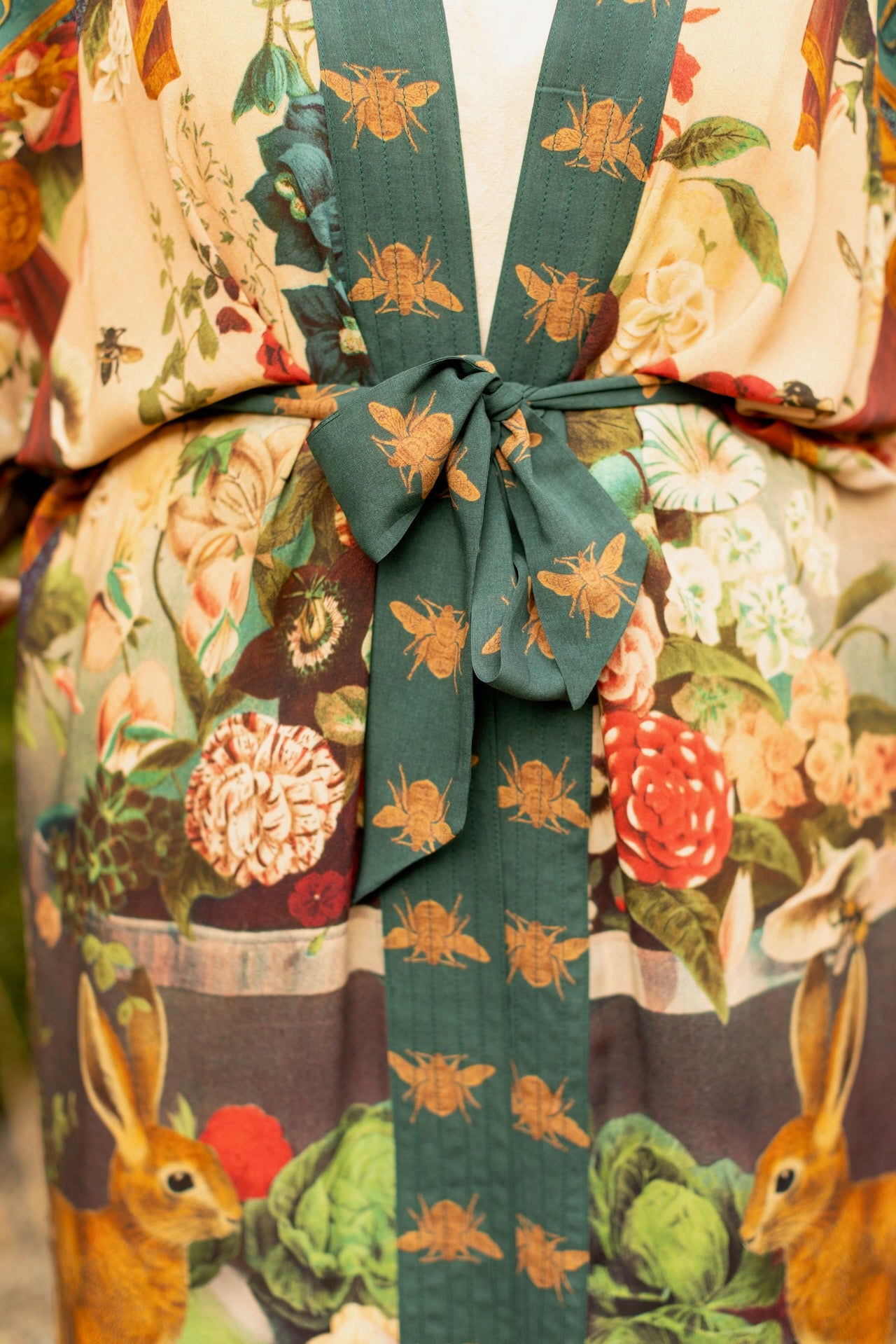 Model wearing Stay Gold Opera Duster with wildflower, bee, and bunny rabbit illustrations, golden script, and vintage collage in full-length kimono silhouette – Market of Stars