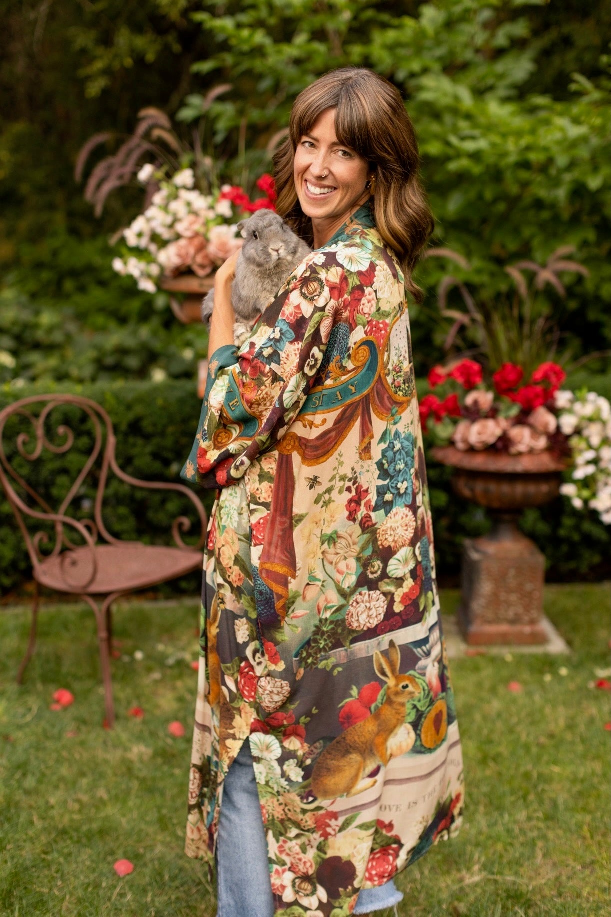 Model wearing Stay Gold Opera Duster with wildflower, bee, and bunny rabbit illustrations, golden script, and vintage collage in full-length kimono silhouette – Market of Stars