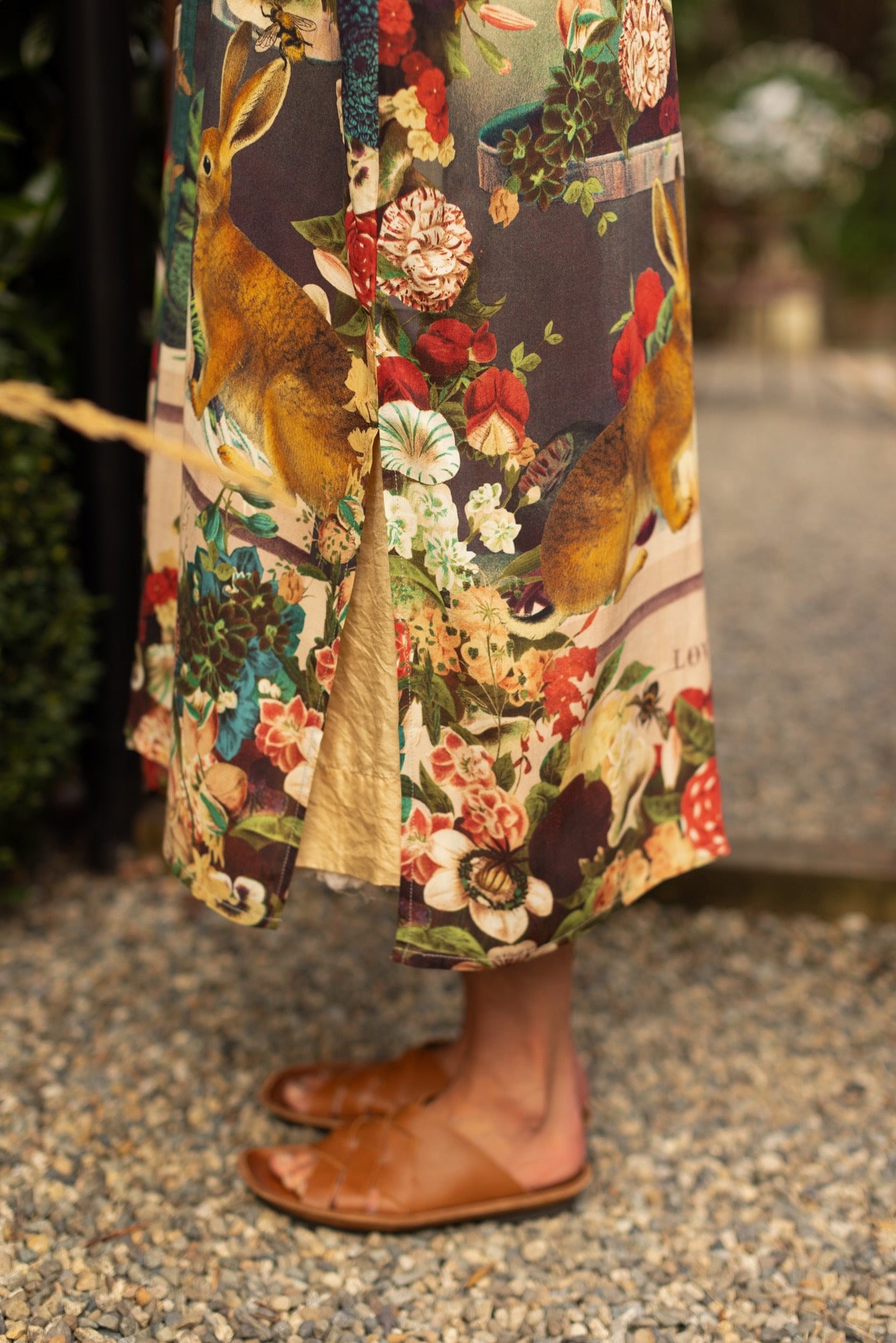Model wearing Stay Gold Opera Duster with wildflower, bee, and bunny rabbit illustrations, golden script, and vintage collage in full-length kimono silhouette – Market of Stars