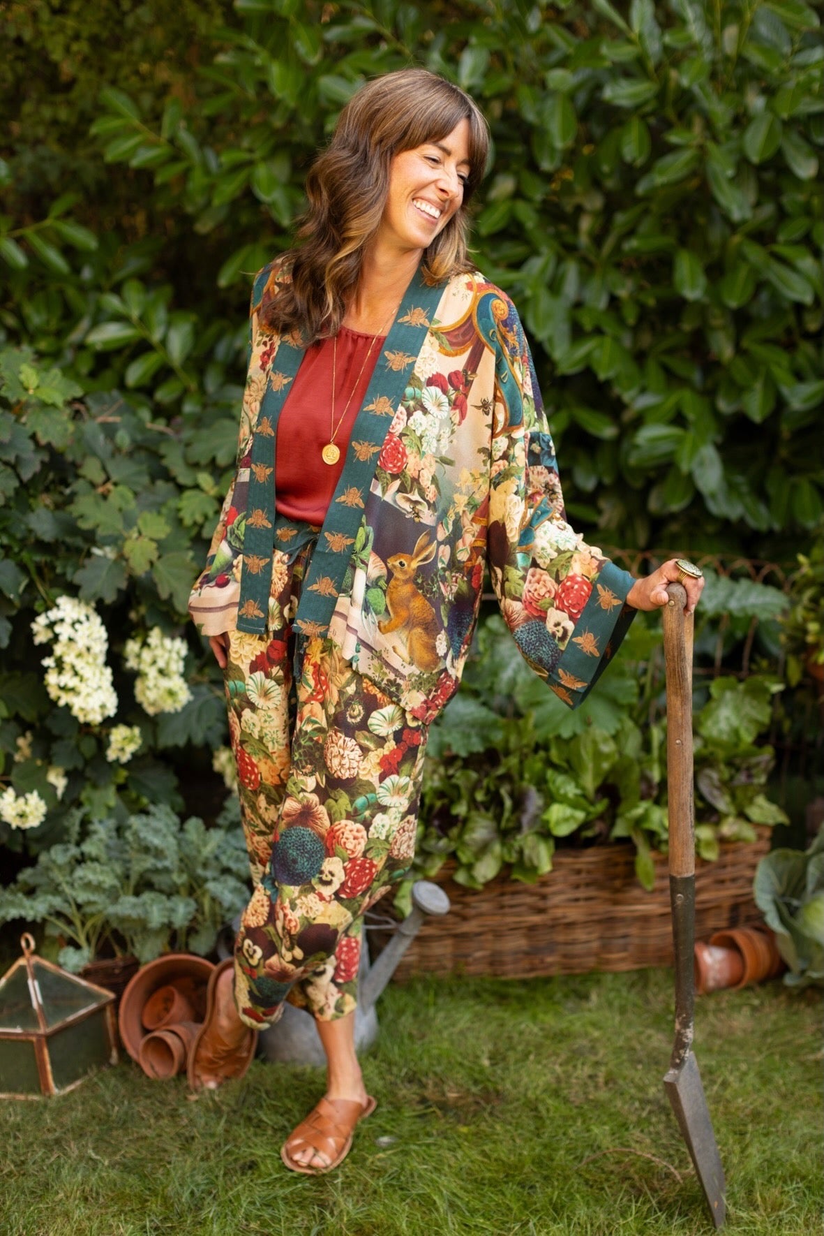 Model wearing Stay Gold linen Artist Pants with lantern hem and floral collage featuring vintage wildflower, bee, and rabbit illustrations – Market of Stars